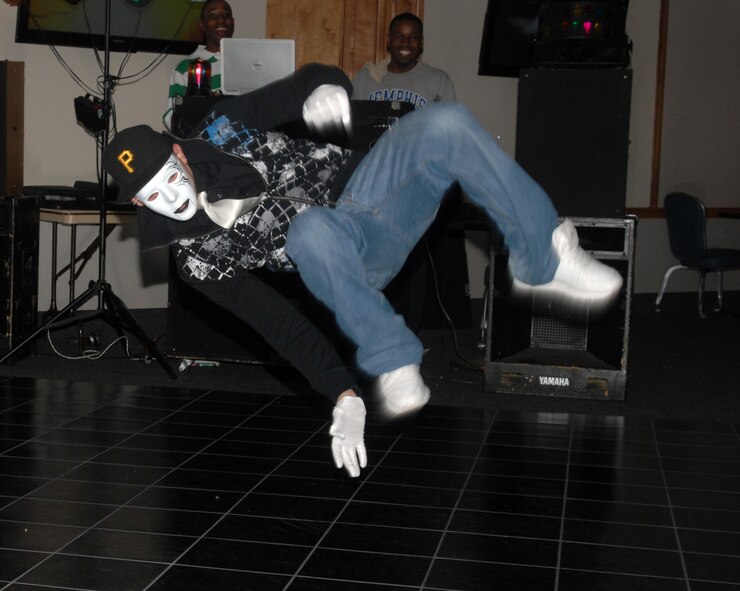 Airman 1st Class Mark Vignale, 2d Aircraft Maintenance Squadron, break-dances during a talent show sponsored by the First Four Airman’s Association April 25 at the Stripes Lounge. Airman Vignale proved to be a crowd favorite and earned third place in the competition. (Senior Airman Alyssa Miles/U.S. Air Force photo)