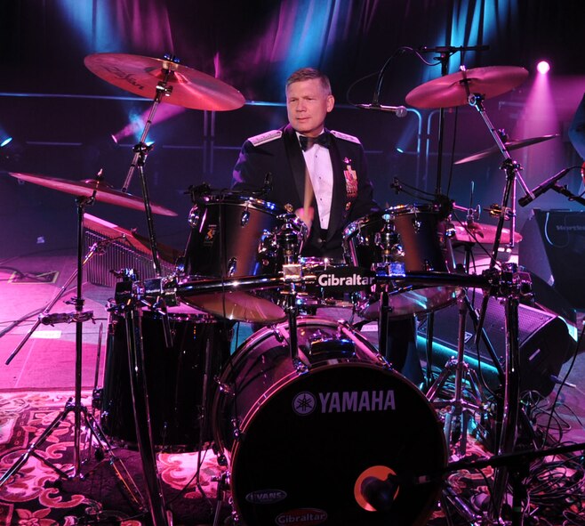 Lt. Gen. Robert Elder, Jr., 8th Air Force commander, plays the drums during the Holiday in Dixie Military Ball April 25 at the Horseshoe Casino in Shreveport, La. It has been tradition for General Elder to show off his skills for the guests. (United States Air Force photo by Senior Airman Alexandra Sandoval) 