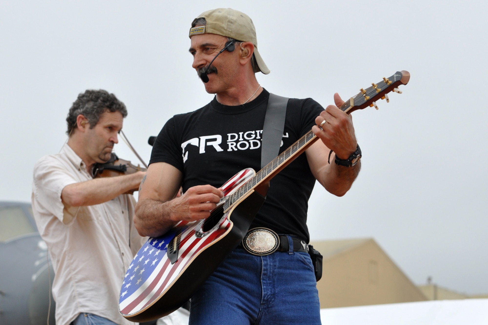 Country music star Aaron Tippin wowed the audience during a live Mother’s Day performance at the Defenders of Liberty Air Show 2009, at Barksdale Air Force Base, La., May 10. Not even rain showers could keep Tippin from performing for the veterans or the audience on Mother’s Day. (US Air Force photo/Tech. Sgt. Jeff Walston)