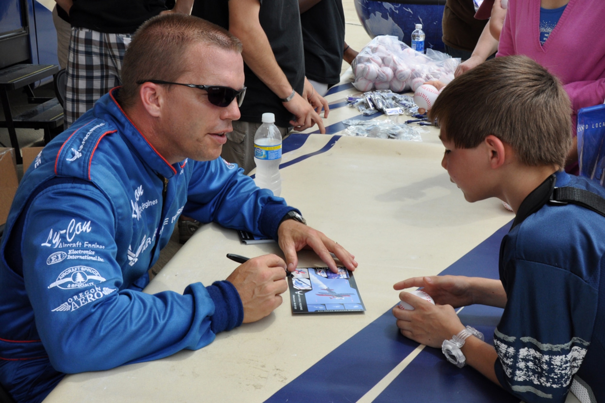Ed Hamill signs autographs after a performance in his Air Force Reserve biplane during the Defenders of Liberty Air Show 2009, at Barksdale Air Force Base, La., May 9. Ed combines the history of airshow flying and the Air Force Reserve with his message: set goals, work hard and never give up. Ed has been flying aerobatics since 1998. (US Air Force photo/Tech. Sgt. Jeff Walston)