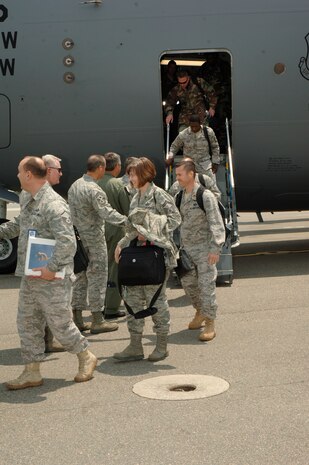 The Inspector General team is greeted by members of team Charleston after stepping off a C-17 here May 11. CAFB underwent a week long unit compliance inspection including a base wide exercise to ensure mission readiness capabilities. (U.S. Air Force photo/Staff Sgt. Marie Cassetty)