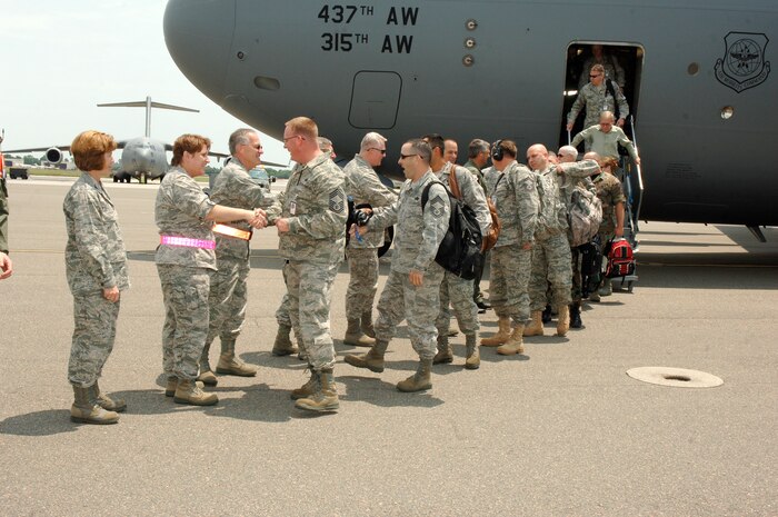 Members of team Charleston greet the Inspector General team on the flightline here May 11. More than 85 inspectors arrived at Charleston AFB to conduct a unit compliance inspection to ensure the base is mission ready. (U.S. Air Force photo/Staff Sgt. Marie Cassetty)