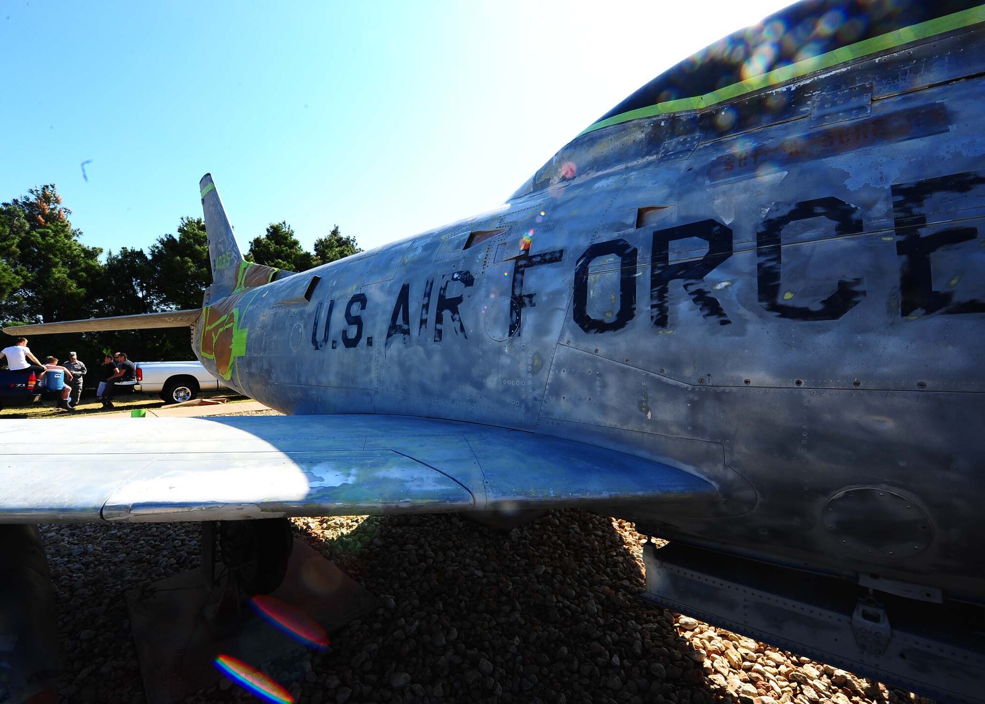 DYESS AIR FORCE BASE, Texas - Airmen from the 7th Equipment Maintenance Squadron work to repaint an F-86 located in the Dyess Air Park May 12. This is the first paint job on the plane since the late 1980s. (U.S. Air Force photo by Airman 1st Class Stephen Reyes)
