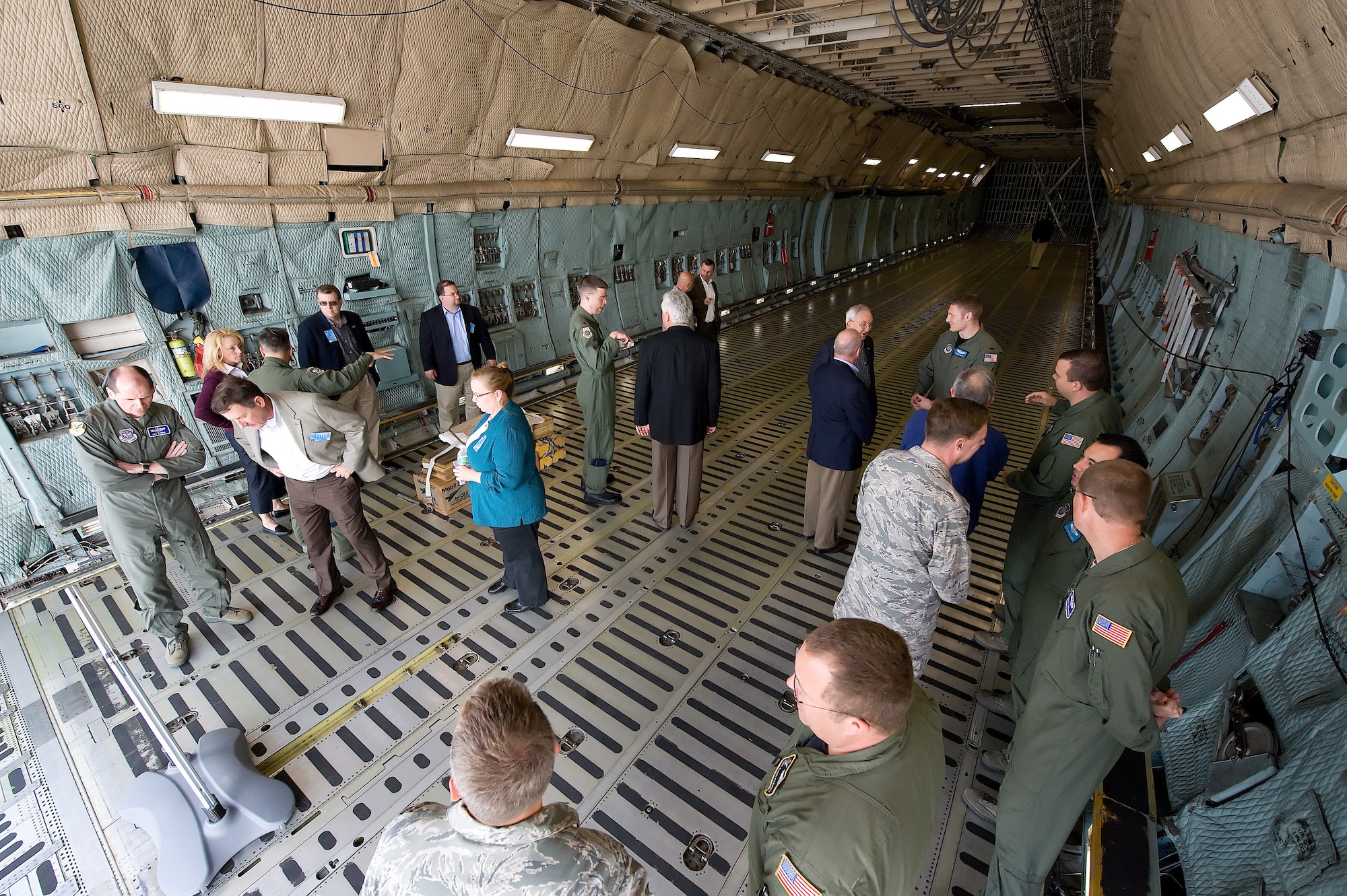 Military and industrial leaders tour a C-5M Super Galaxy at Dover Air Force Base, Del., May 7. Members of the National Defense Transportation Association Military Airlift Committee received a tour of the Aerial Port, C-5M and C-17 Globemaster III before holding their semi-annual meeting May 8. (U.S. Air Force Photo/Jason Minto)