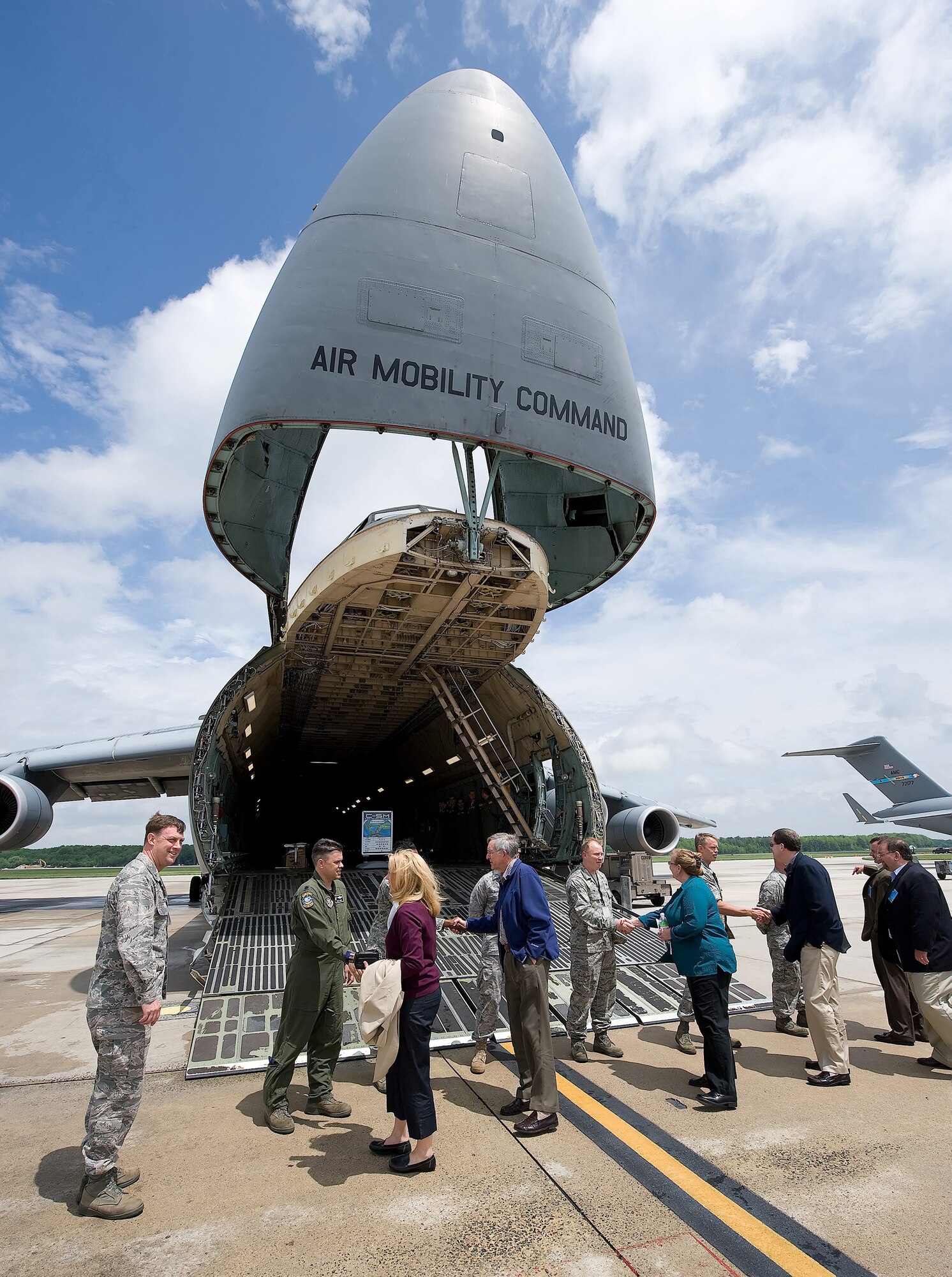 Military and industrial leaders meet crew members before touring a C-5M Super Galaxy at Dover Air Force Base, Del., May 7. Members of the National Defense Transportation Association Military Airlift Committee received a tour of the Aerial Port, C-5M and C-17 Globemaster III before holding their semi-annual meeting May 8. (U.S. Air Force Photo/Jason Minto)