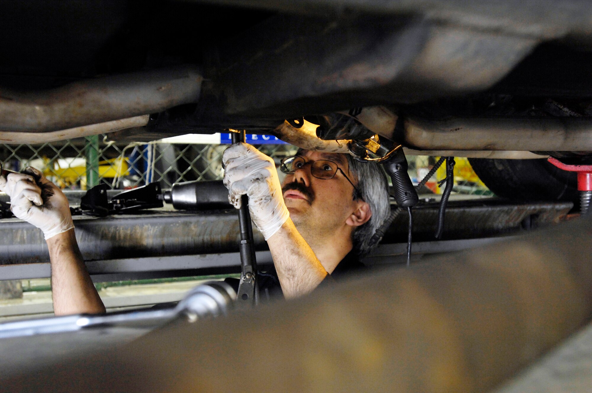 ELMENDORF AIR FORCE BASE, Alaska -- Wes Rasmassen from the Elmendorf Auto Hobby Shop carefully removes the transmission from this 1971 Chevey Corvette May 7. Rasmassen has been with the shop for the past 10 and a half years.(U.S. Air Force photo/Airman 1st Class Christopher Gross)