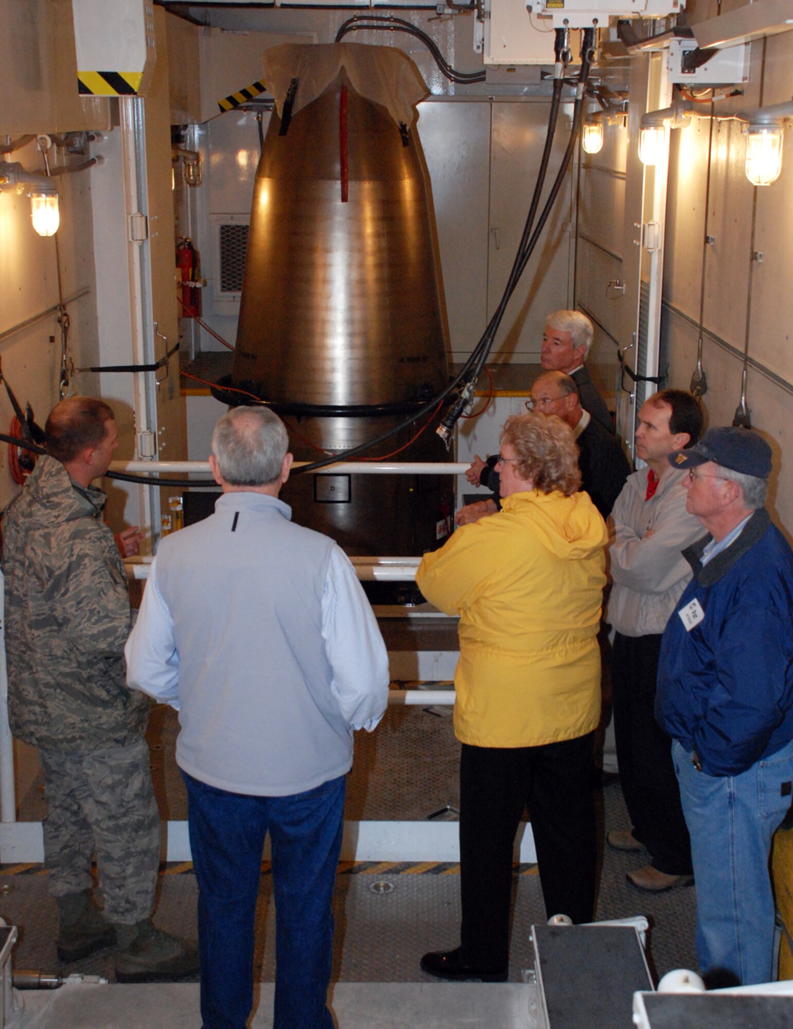 The honorary commanders listen to a briefing about missile operations and maintenance at Uniform-1 May 2 during the honorary commander kick-off tour. Each commander on base had a civilian counterpart choosen.