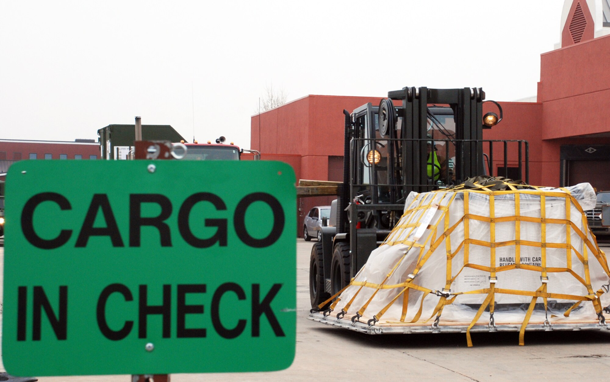 The cargo inchecking area is designed so the Airmen unloading the carg can inspect and process equipment. If there are any problems with a pallet, it could be delayed, and it will have to be fixed before it is processed and ready for transport.