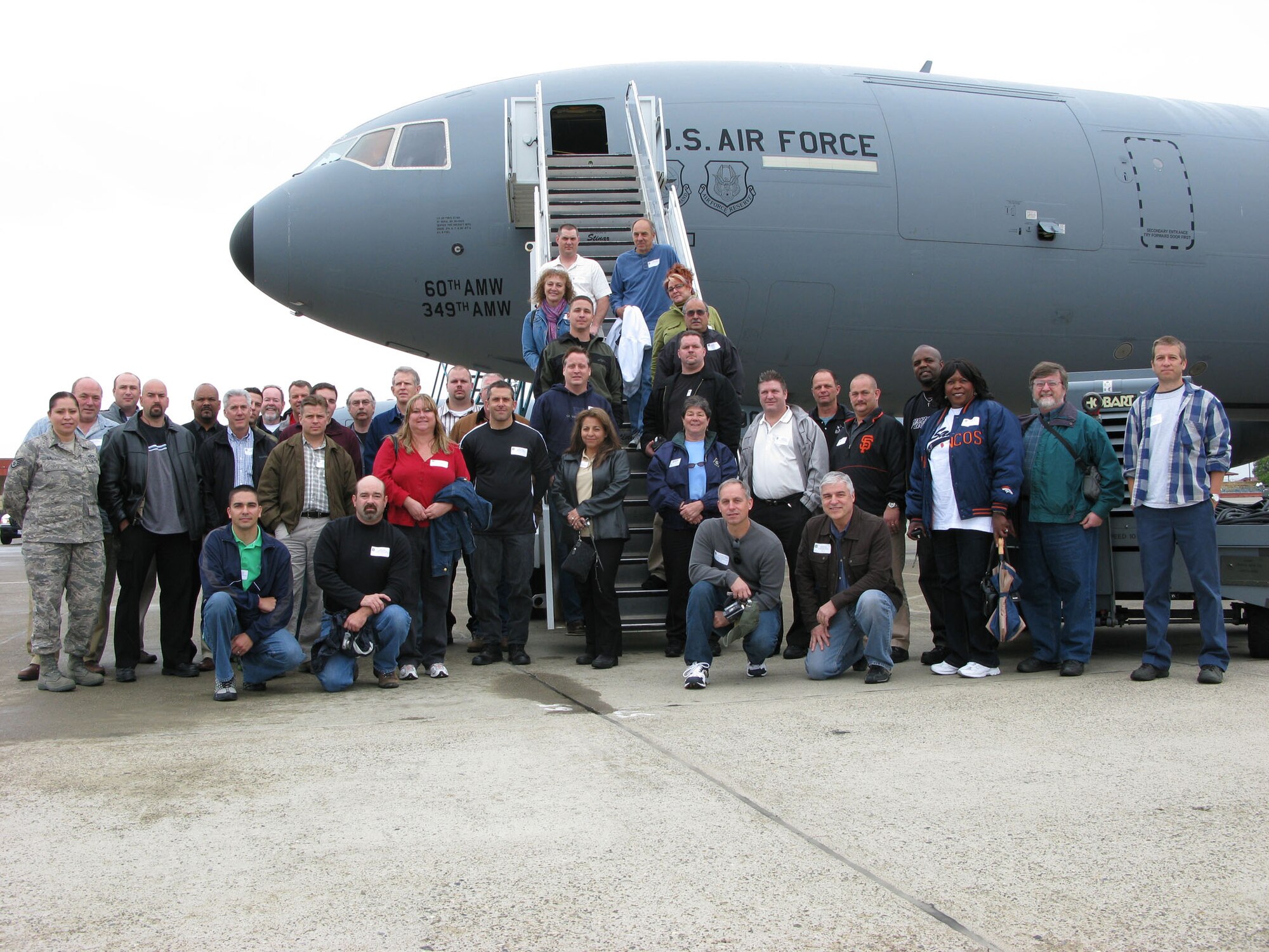 TRAVIS AIR FORCE BASE, Calif. -- A number of employers gather for a group photo in front of a KC-10 Extender here prior to the 349th Mission Support and 349th Operation Gourp Employer Appreciation flight conducted May 2. Seventy employers and their military escorts participated in the flight.(U.S. Air Force photo/Master Sgt. Robert Wade)