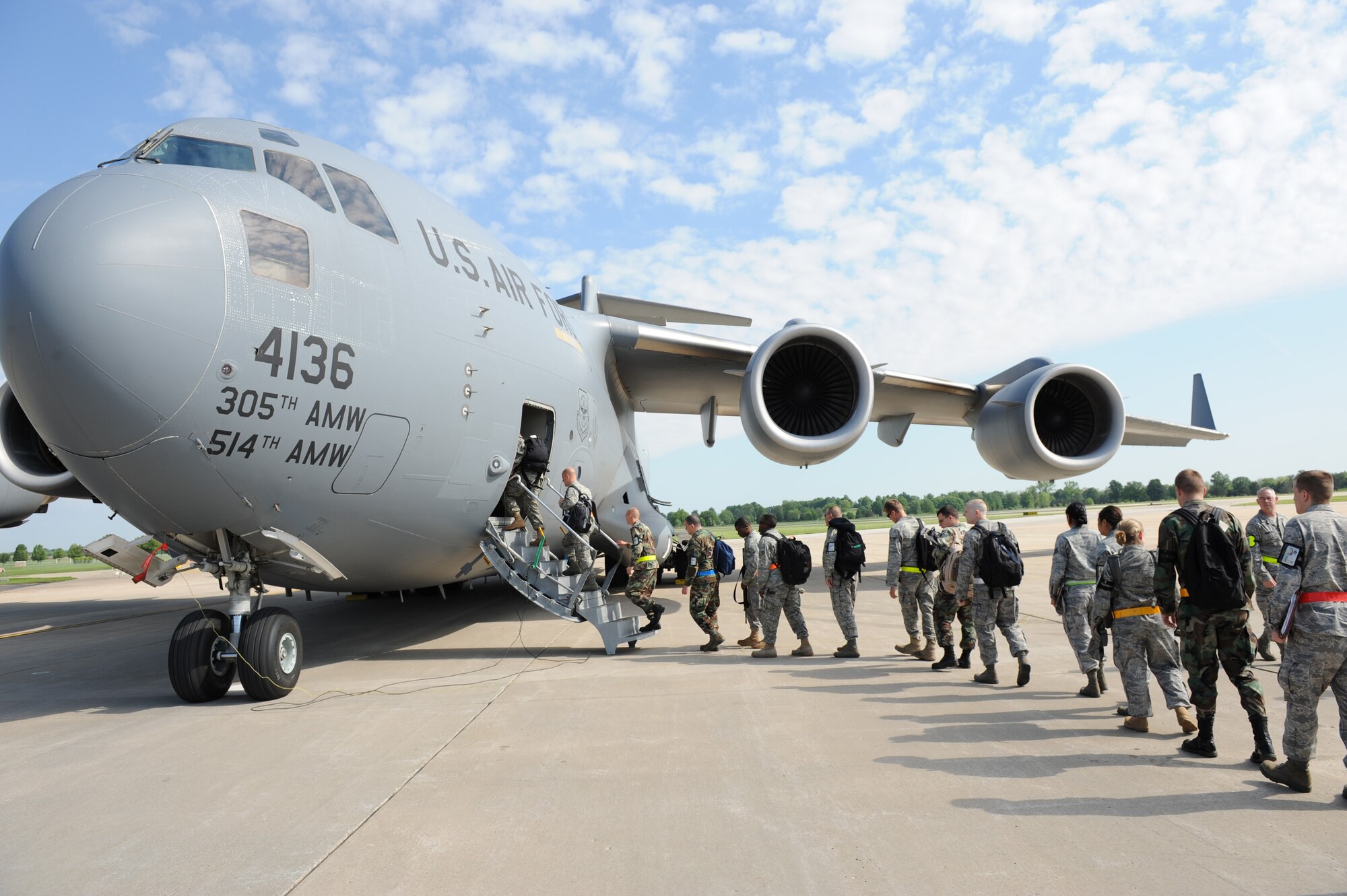 Approximately 50 Airmen from the 375th Airlift Wing board a C-17 Globemaster III May 11 as part of a contingent headed to Volk Field, Wisc.. There they will train with Minnesota Air National Guard's 133rd Airlift Wing and the 94th Aerial Port Squadron (Reserve) out of Robins AFB, Ga.  The exercise and training mission will last through May 17 and is designed to prepare the units for their Operational Readiness Inspection slated for March 2010.  The C-17 is from McGuire Air Force Base, N.J. (U.S. Air Force photo/Staff Sgt. Paul Villanueva II)