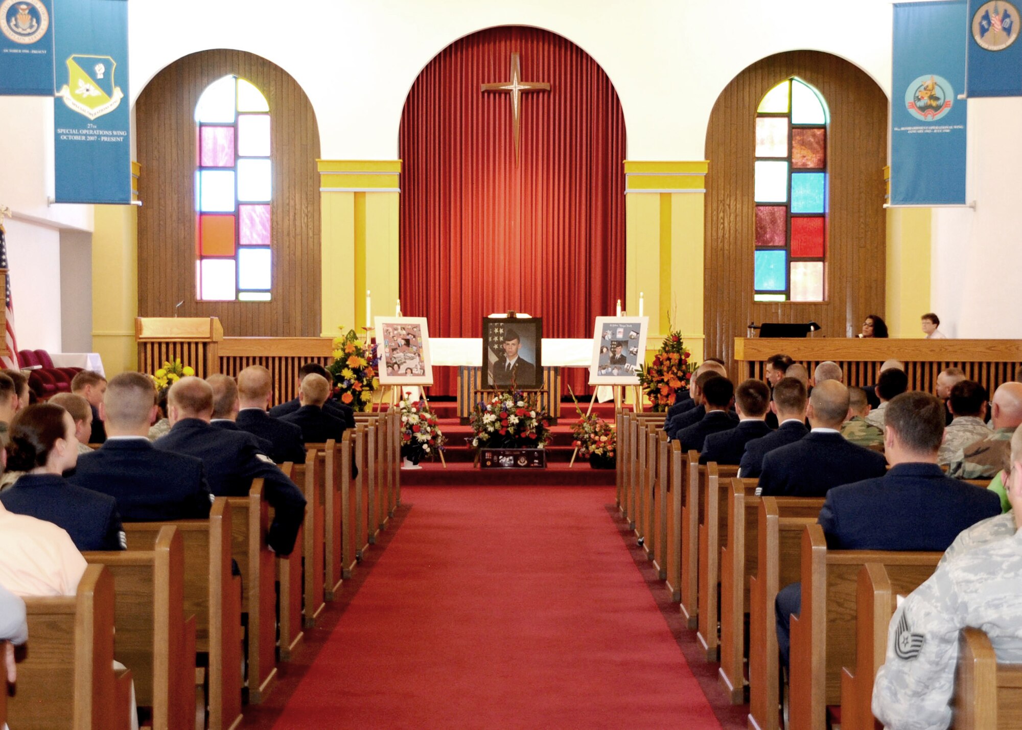 CANNON AIR FORCE BASE, N.M.--  Cannon Airmen gather at the base chapel May 6 for memorial service in honor of Airman 1st Class Andrew Arnett. Airman Arnett and his passenger, Christy Thatcher, died in a vehicle crash in Weatherford, Okla. accident April 23. (U.S. Air Force photo by Airman Maynelinne De La Cruz)