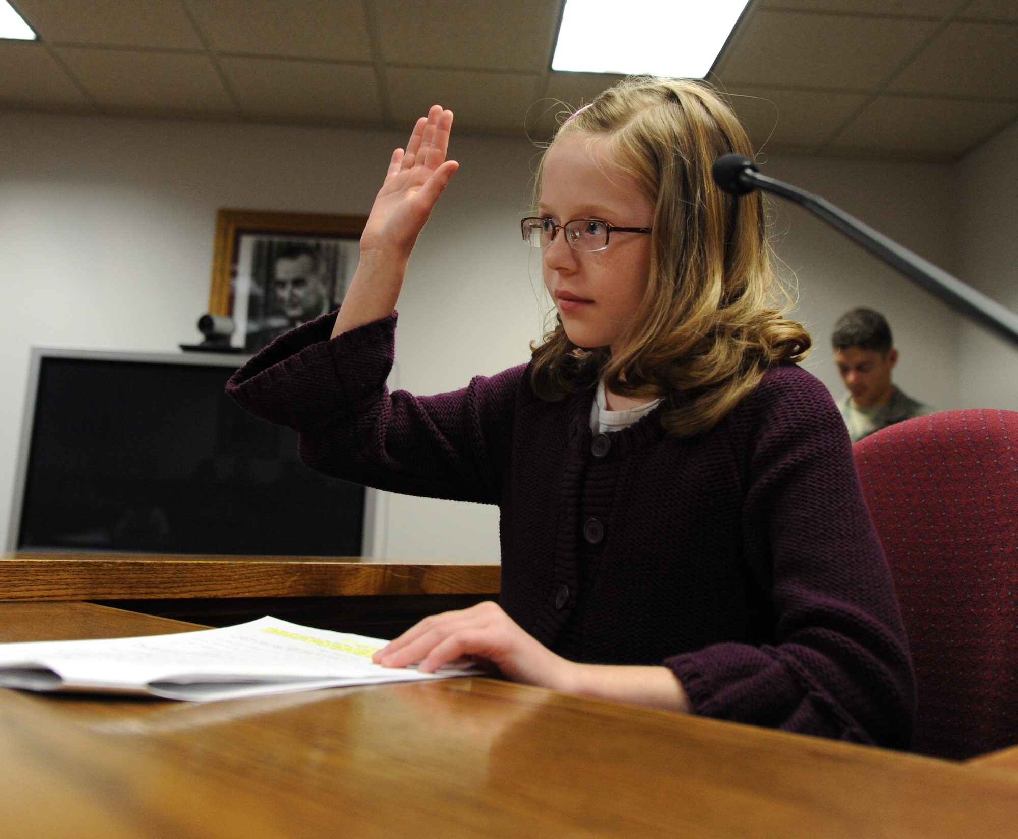 MOUNTAIN HOME AIR FORCE BASE, Idaho-- Emmelyn Redd, a fourth grader from the Base Primary School who is on trial as Gold E. Locks from the children’s story Goldilocks and the Three Bears, recites the oath before giving her testimony in the mock trial hosted by the 366th Fighter Wing Legal Office as part of Law Day May 8. After deliberation, Gold E. Locks was found guilty. Sponsored by the American Bar Association, Law Day is held May 1, and this year’s theme was “Abraham Lincoln’s Bicentennial.” (U.S. Air Force photo/Airman 1st Class Renishia Richardson)