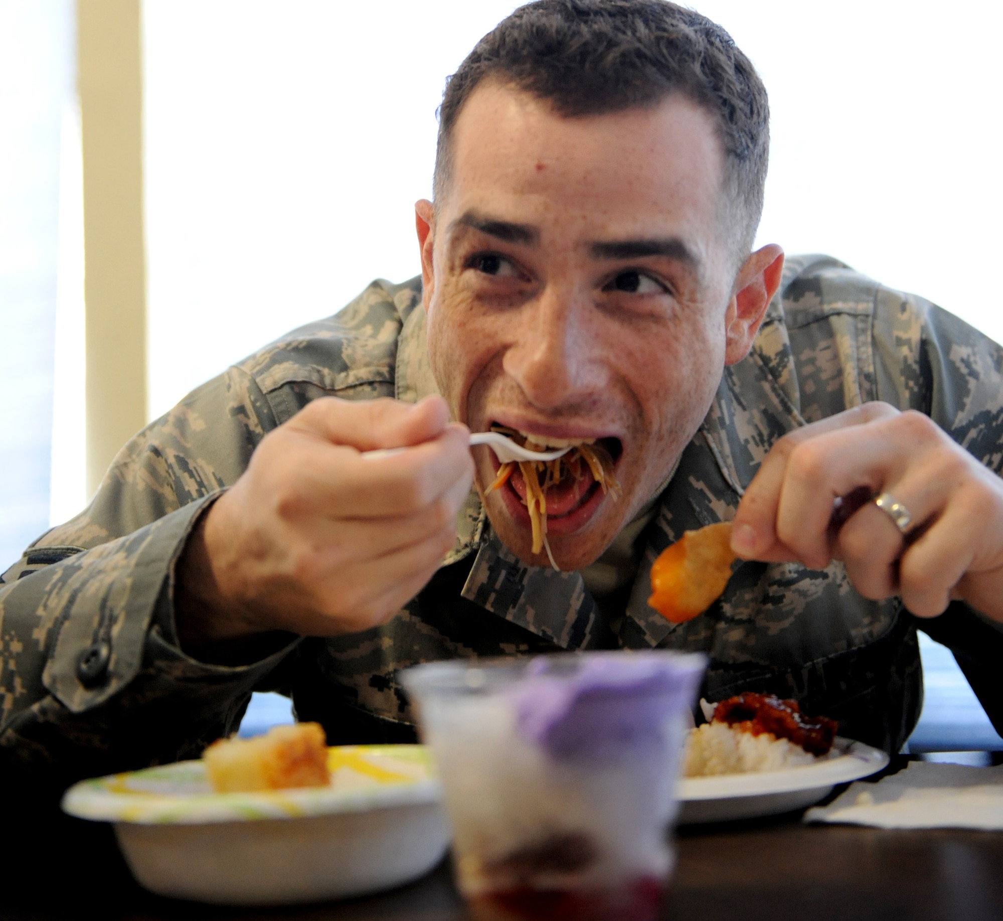 MOUNTAIN HOME AIR FORCE BASE, Idaho – Tech. Sgt. Louis Lanton, 726th Air Control Squadron weapons director, samples dishes from the Asian Pacific American Heritage Committee’s taste fest May 6. Each May, the base joins other installations and organizations across the nation to celebrate Asian-Pacific heritage and honor the contributions these Americans made throughout U.S. history. (U.S. Air Force photo\Airman 1st Class Debbie Lockhart)