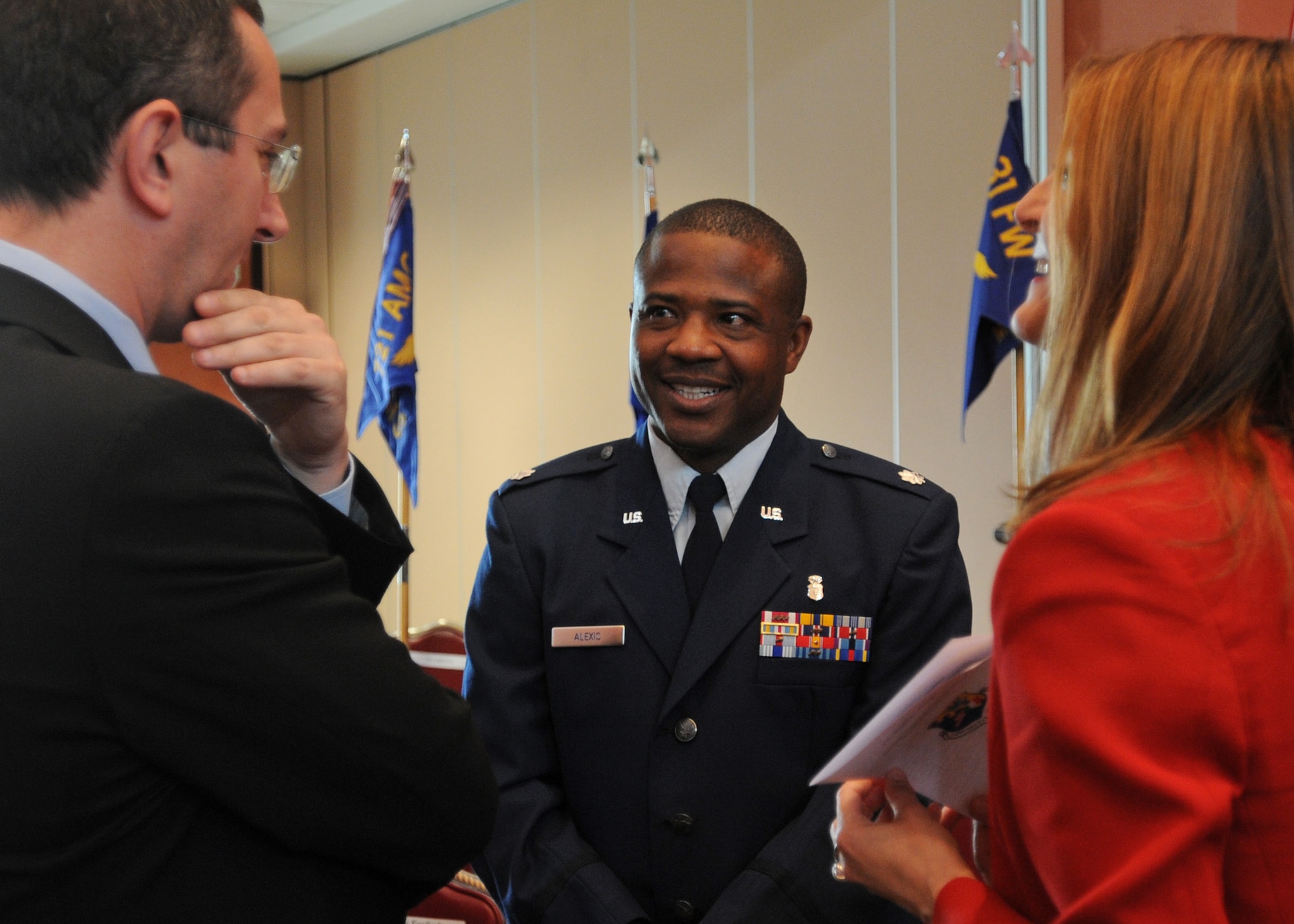 Lt. Col. Martin Alexis, 31st Aerospace Medicine Squadron deputy commander, mingles with Dr. Luca Balestreri and his wife Sandra, following Mr. Balestreri's induction into the 31st Fighter Wing Honorary Squadron Commander Program May 8, 2009, at Aviano Air Base, Italy.  Mr. Balestreri is the new HSC for the 31st AMDS and is a radiologist with the Centro di Riferimento Oncologico.  (U.S. Air Force photo/Staff Sgt. Patrick Dixon)