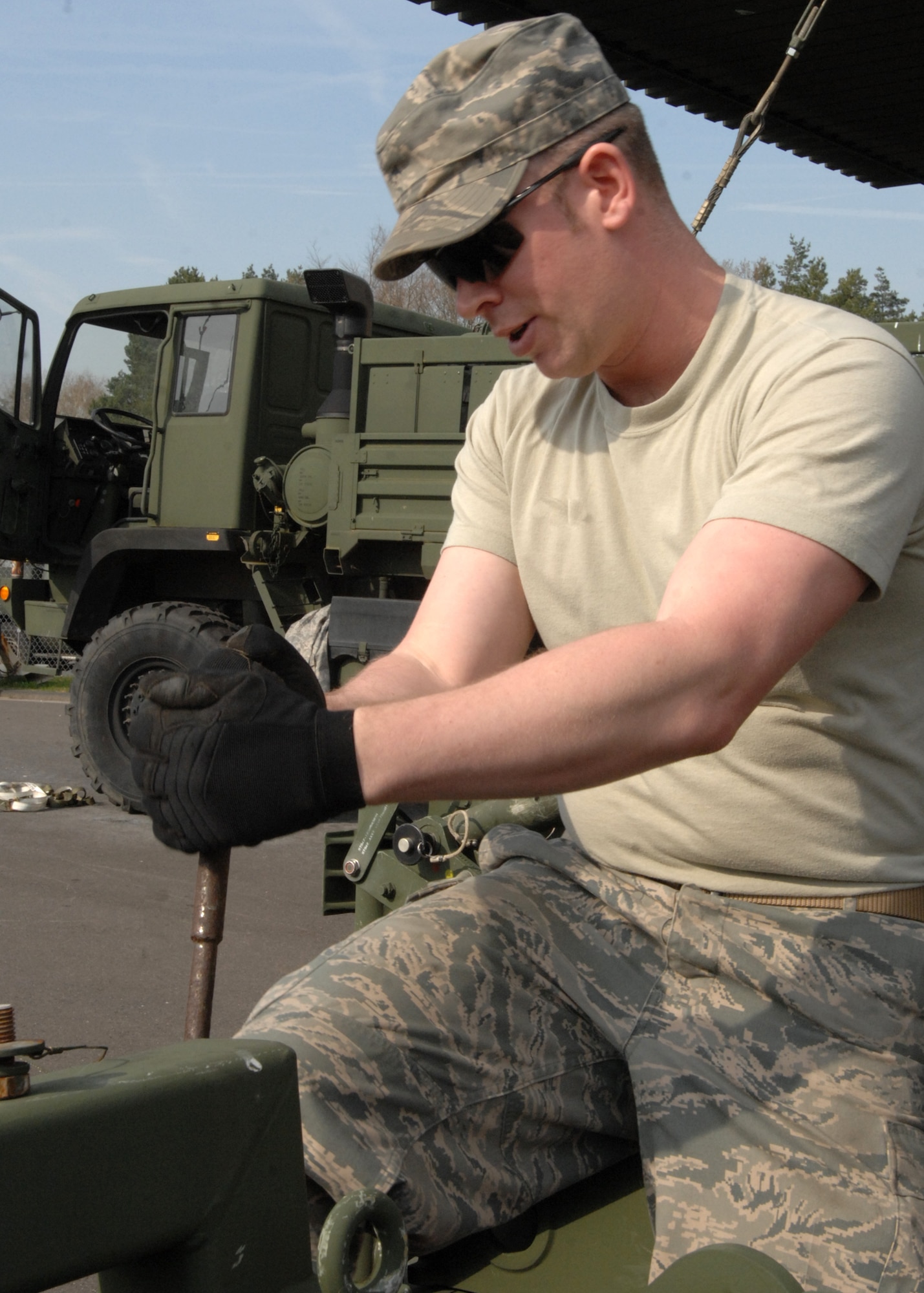 SPANGDAHLEM AIR BASE, Germany – Staff Sgt. David Coles, 606th Air Control Squadron, prepares an M-832 mobilizer for installation on an AN/TPS-75 Radar System antenna. The AN/TPS-75 is a mobile, tactical radar system capable of providing long-range radar data to support operations and control of tactical aircraft. (U.S. Air Force photo by Senior Airman Jenifer Calhoun)