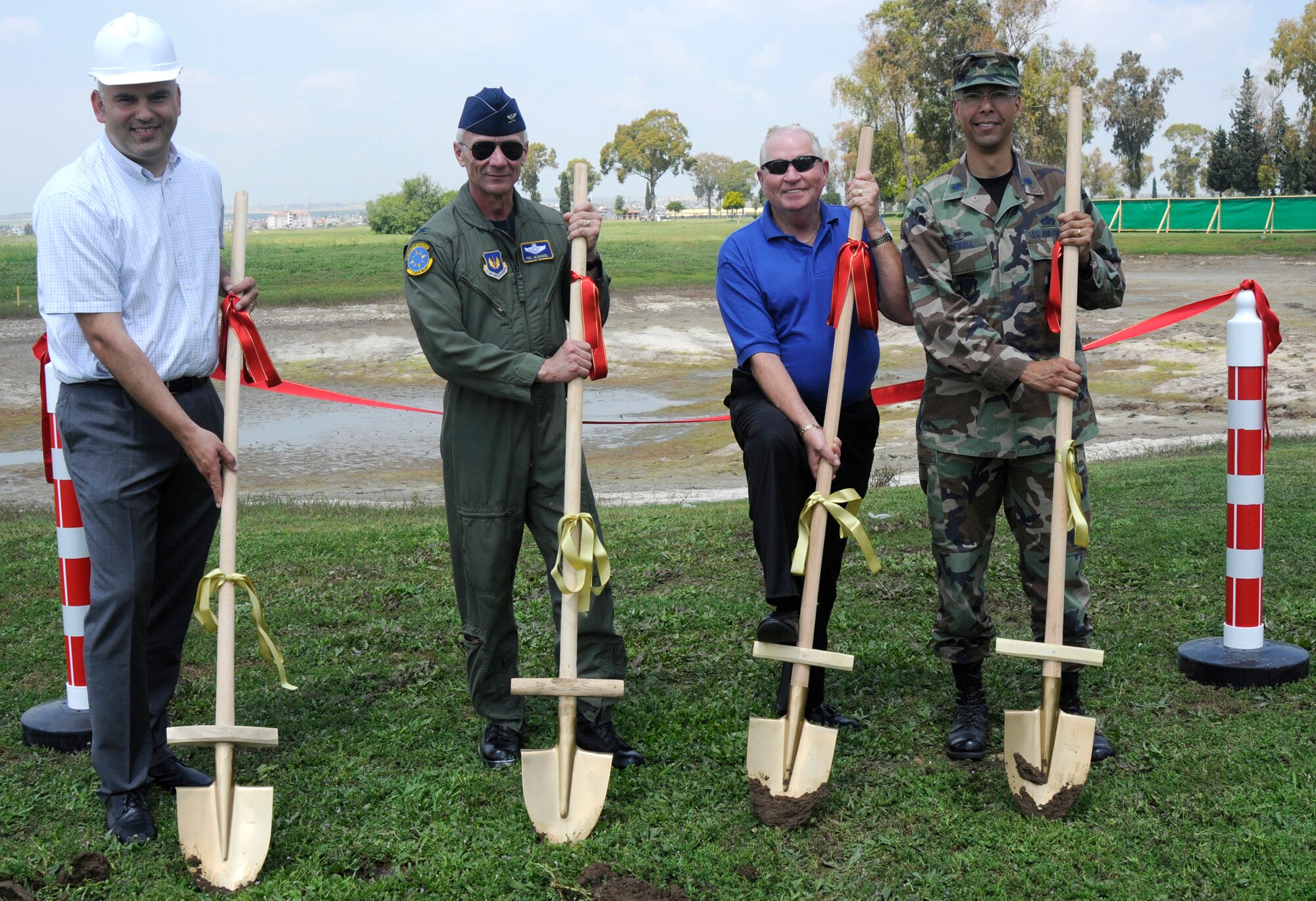 Ismail Aytekin, contractor with Aytekin Serol, Col. Philip McDaniel, 39th Air Base Wing commander, Tom Carneal, Vinnell, Brown and Root corporation deputy director of civil engineering, and Lieutenant Col. Randy Boswell, 39th Civil Engineer squadron commander break ground at the “construct waste water reuse irrigation system” project opening ceremony at Incirlik’s Hodja Lake Golf Course May 8, 2009 at Incirlik Air Base, Turkey. The purpose of the project is the reuse of treated water for the golf course’s irrigation, to replace the currently used potable water, which is supplied from on and off-base wells. This will save energy and money, reducing the potable water demand. The new irrigation system will cover the fairways, tees, greens, internal and external rough areas and driving range.  (U.S. Air Force photo/Airman 1st Class Amber Russell)