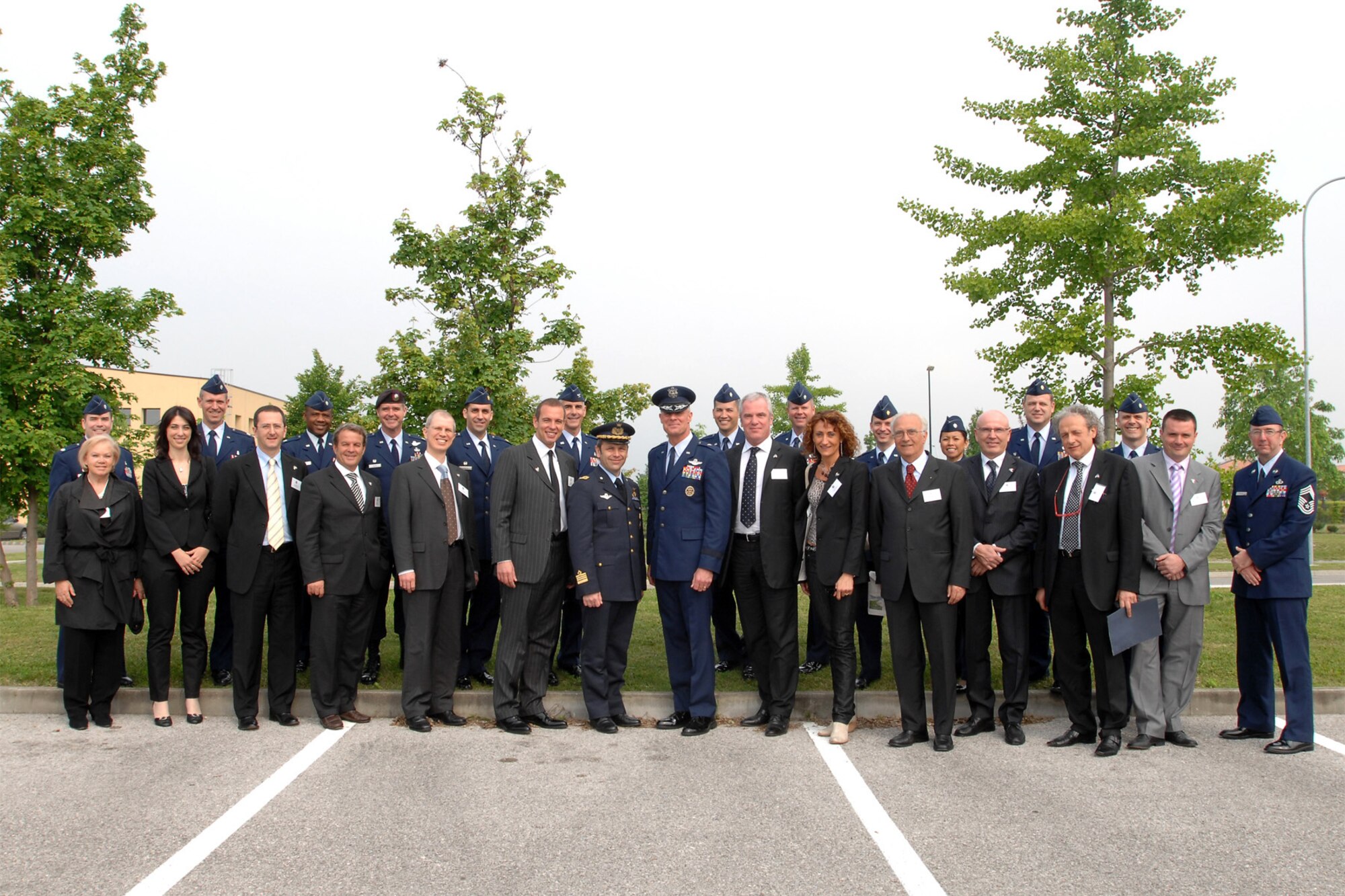 31st Fighter Wing and Pagliano e Gori Airport senior leaders take a group photo with 12 Italian community leaders and their respective U.S. Air Force unit commanders May 8, 2009, prior to the 12 Italians being inducted into the 31st FW Honorary Squadron Commander Program at Aviano Air Base, Italy. (U.S. Air Force photo/Tech. Sgt. Patrick Hyde)
