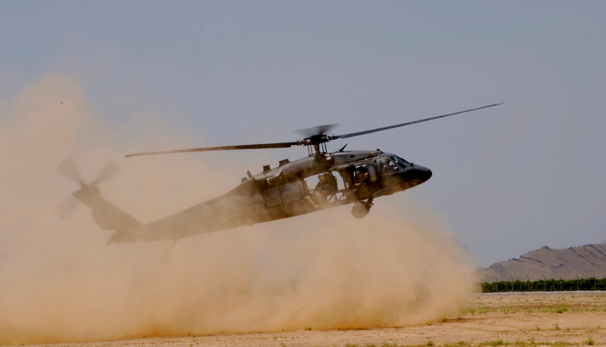 KANDAHAR AIR FIELD, Afghanistan -- A U.S. Army UH-60 Blackhawk helicopter comes in to drop off members of 755th Explosive Ordinance Disposal team and members of the 82nd Airborne Division at Kandahar Airfield, Afghanistan, during a joint training operation in support of Operation Enduring Freedom May 5, 2009.  (U.S. Air Force photo by Staff Sgt. James L. Harper Jr.)