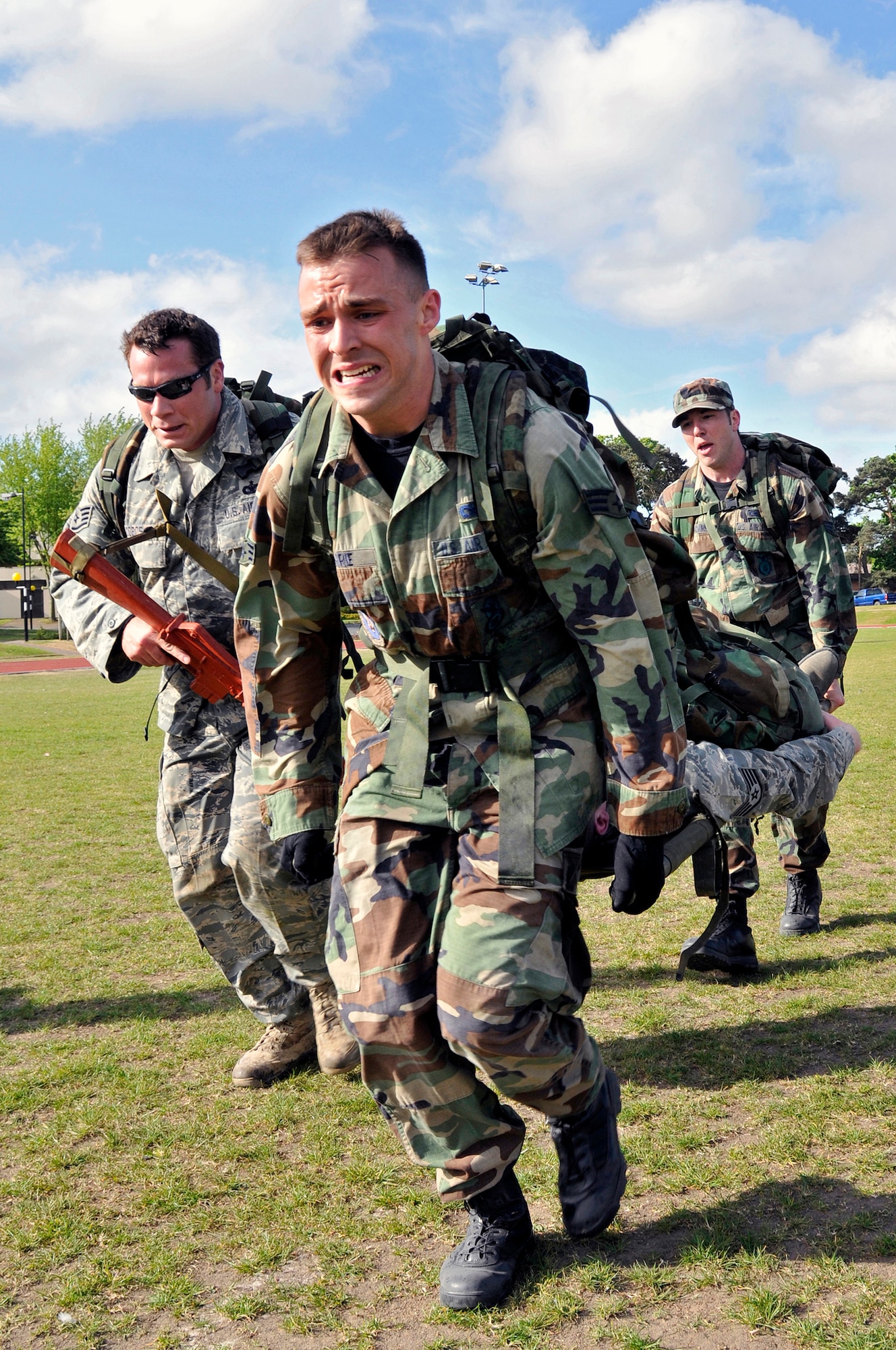 ROYAL AIR FORCE LAKENHEATH, England -- 100th Security Forces Squadron Airmen perform the litter carry during the 5K Ruck march May 11, 2009. The litter carry was the last of the tasks during the 5K Ruck march for National Police Week May 11 to 15.  (U.S. Air Force photo by Airman 1st Class Perry Aston) 