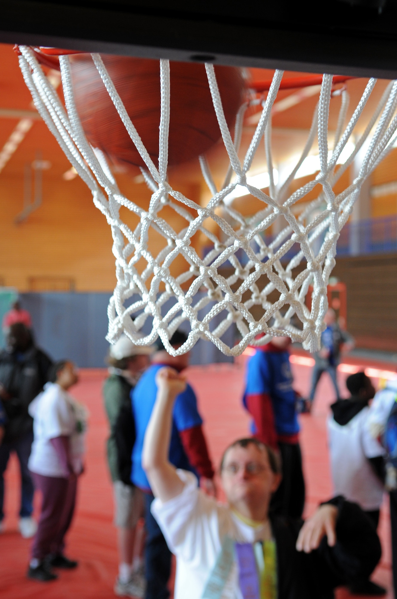 A German local national plays a game of basketball during the 36th Annual Special Olympics held in Enkenbach-Alsenborn, Germany, May 6, 2009. Special Olympics is an international program of year-round sports training and athletic competition for more than 1.7 million children and adults with disabilities in more than 150 countries including Germany. (U.S. Air Force photo by Airman 1st Class Grovert Fuentes-Contreras)(Released)