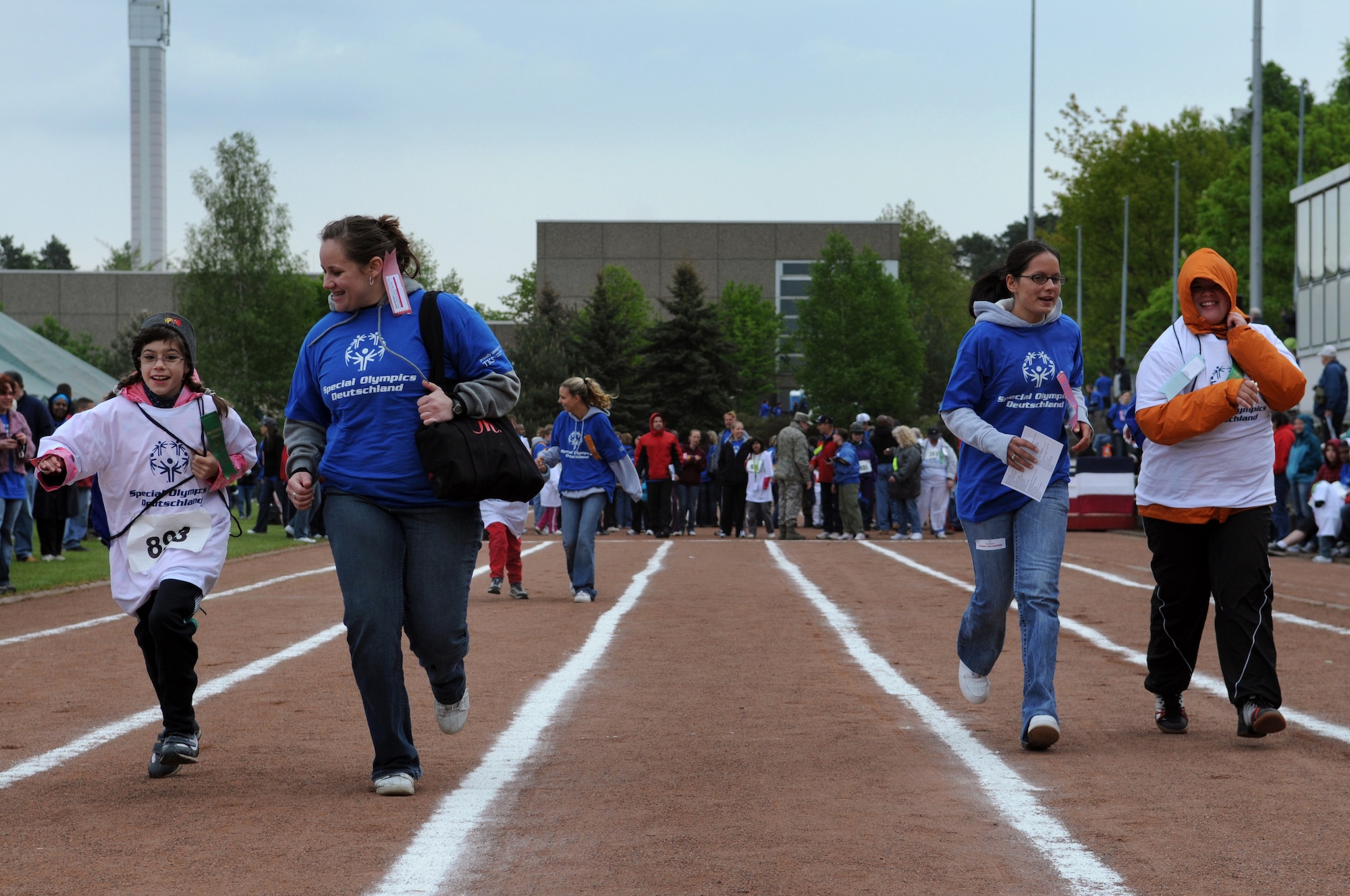 Athletes and their buddies run a race at the 36th Annual Special Olympics held in Enkenbach-Alsenborn, Germany, May 6, 2009. Special Olympics is an international program of year-round sports training and athletic competition for more than 1.7 million children and adults with disabilities in more than 150 countries including Germany. (U.S. Air Force photo by Airman 1st Class Grovert Fuentes-Contreras)(Released)