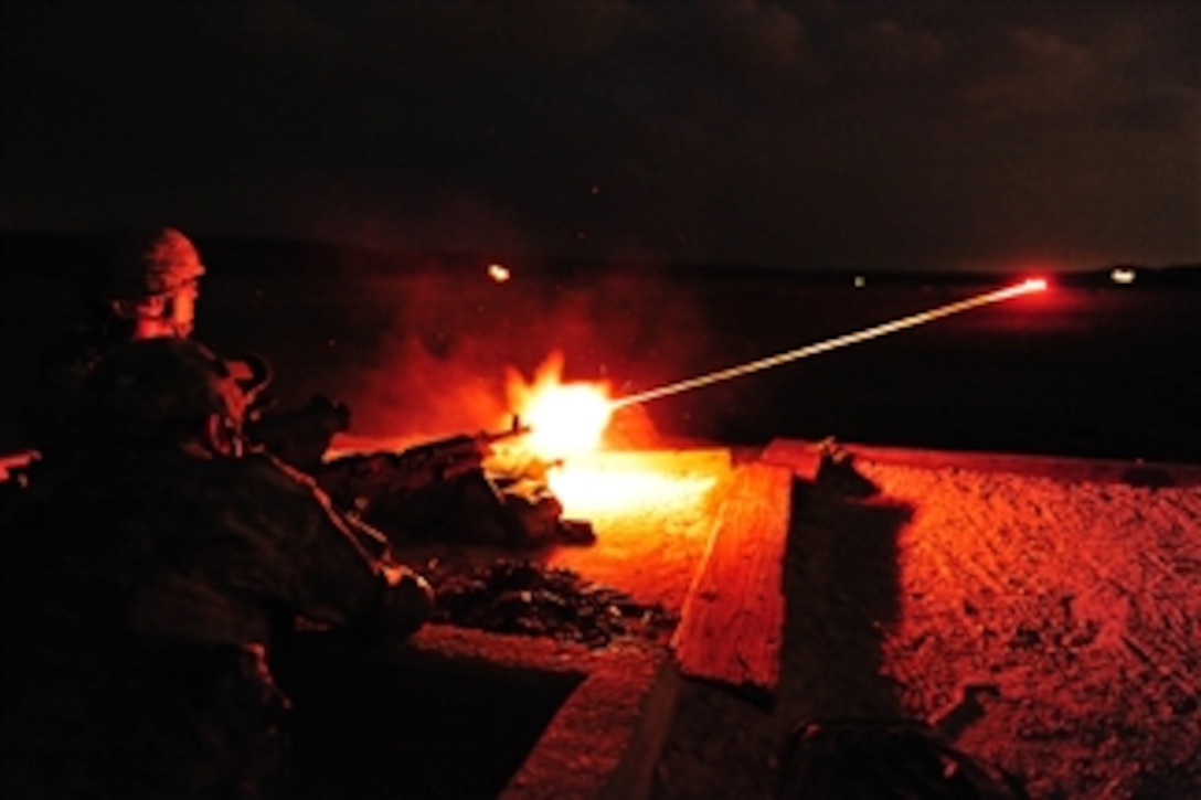 U.S. Army soldiers assigned to 3rd Battalion, 157th Field Artillery, Colorado Army National Guard, light up the range with tracer rounds as they fire the M-240B medium machine gun with the help of night optics at Fort Hood, Texas, on April 25, 2009.  The battalion, which arrived at its mobilization station on April 18, is deploying this summer in support of Operation Iraqi Freedom.  