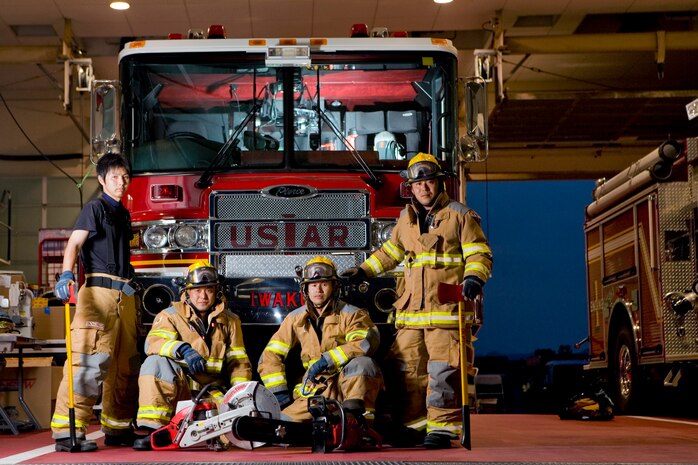 With one of its urban search and rescue vehicles “Godzilla,” and a proactive plan to make this season safe, the Iwakuni Fire Department here is more ready than ever to battle this year’s tropical cyclones. Pictured from left to right are firefighters Kurokawa Hiroaki, Niwata Takuya, Imasaki Terufumi and Matsuoka Junji.