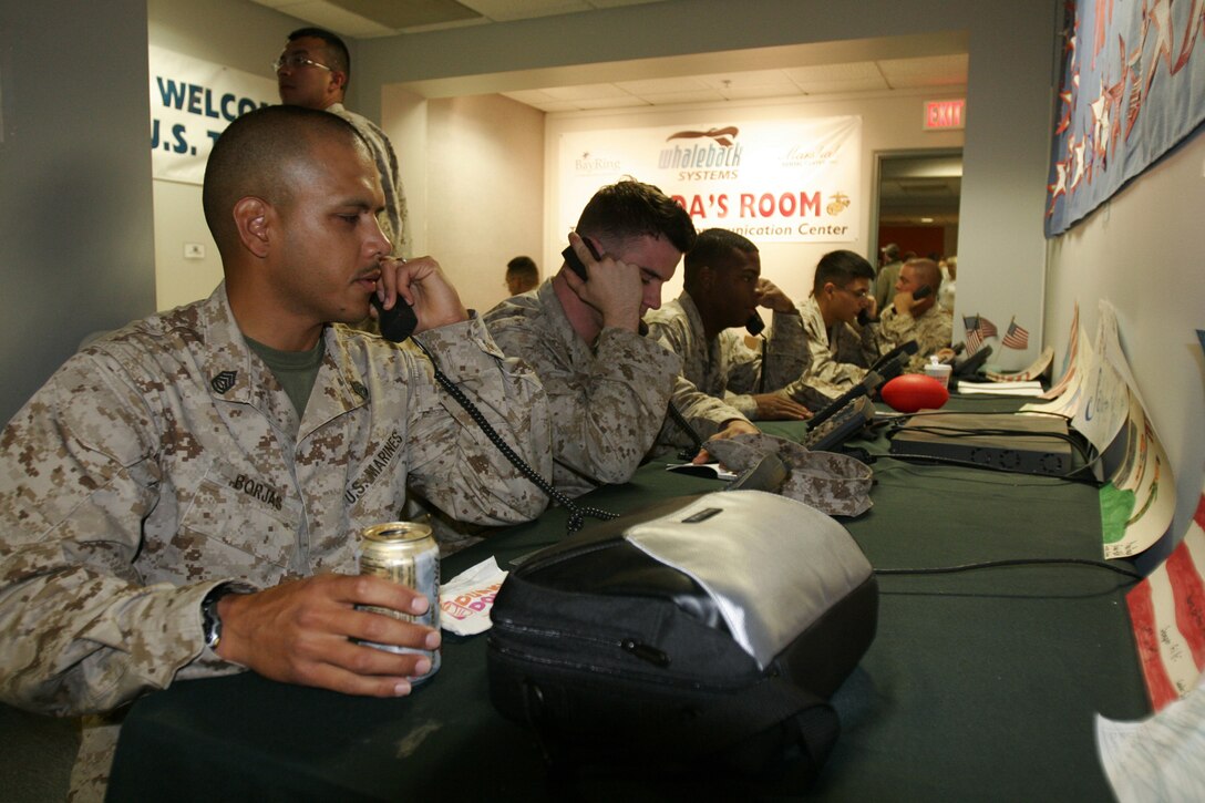 Marine Attack Squadron 214 Marines make free phone calls home during a flight layover in Portsmouth, N.H., en route to southern Afghanistan May 10, 2009. The Blacksheep will be deployed as the sole AV-8B Harrier squadron of Marine Aircraft Group 40, which is formed for the first time since it’s deactivation after the Gulf War.