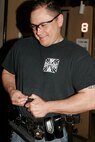 Chicago native and former Marine Sgt. Jorge Heredia muscles a .45 caliber round into the clip of his Glock 21 during a tactical and pistol marksmanship training exercise at the Chicago Police Education and Training Academy. Heredia spent more than eight years in the Marine Corps and now has almost 10 years under his belt as a law enforcement officer in Chicago.