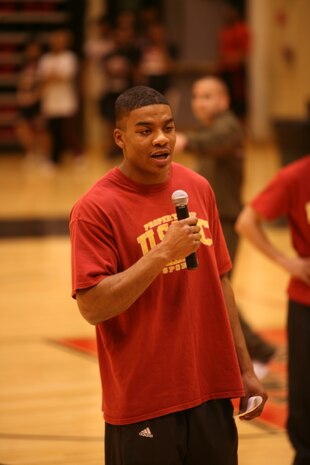 Lance Cpl. Bryant Tune, 23, a heavyweight boxer for the Marine Corps Boxing Team, talks to kids at Proviso West High School during Marine Week Chicago. Tune, from Nathalie, Va., and two other members of the Marine Corps Boxing Team led students through various boxing exercises. The event was on of many for the boxing team during Marine Week Chicago.