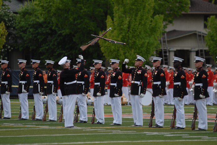 The Silent Drill Platoon performs for spectators at Oak Park Forest River High School May 12, during Marine Week 2009. More than 2,000 Marines came to Chicago offering its citizens the opportunity to get to know the men and women of the Corps and learn about its history, traditions and value to the nation.