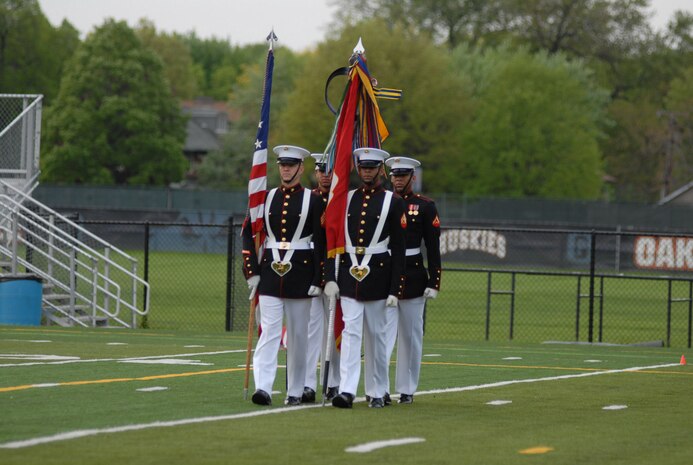 The Marine Corps Color Guard, from Marine Barracks Washington, D.C., present the colors for a Battle Color Detachment performance at Oak Park Forest River High School May 12, during Marine Week 2009. More than 2,000 Marines came to Chicago offering its citizens the opportunity to get to know the men and women of the Corps and learn about its history, traditions and value to the nation.