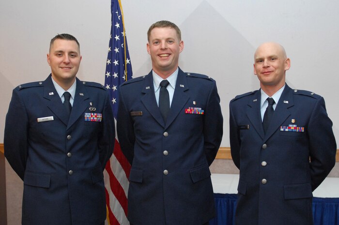 Nellis Air Force Base, Nev.-- (left to right) 1st Lt. James N. Moore, 1st Lt. Jason D. Hamilton and 1st Lt. Wesley P. Arnold are the newest graduates of the 99th Medical Group's Physician Assistant Class. Upon graduation, the three physician assistants commissioned as first lieutenants in the U.S. Air Force at a ceremony here, May 7.  After completion of the two year program, the graduates received a Master of Physician Assistant Studies from the University of Nebraska School Of Medicine. (U.S Air Force photo/ Staff Sgt. Taylor Worley)(Released)