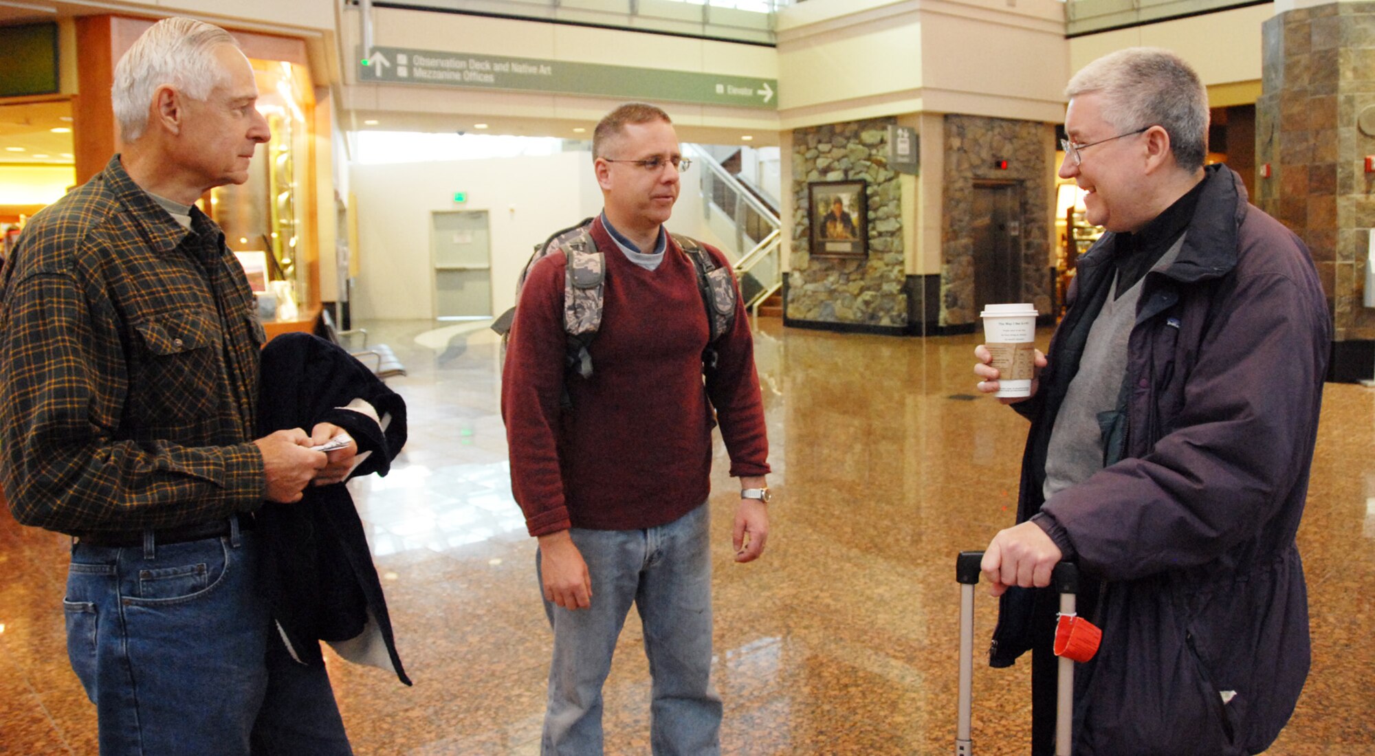 ELMENDORF AIR FORCE BASE, Alaska – Larry Thomas, father of Lt. Col. Kevin Thomas, 477th Civil Engineer Squadron, chatted with Chaplain (Maj.) Pat Travers, 477th Fighter Group, before Colonel Thomas (center) departed for Kirkuk, Iraq, May 4. Colonel Thomas previously commanded the 477th CES, and is currently serving as the deputy commander for the 506th Air Expeditionary Group. Several Airmen with Air Force Reserve Command’s 477th Fighter Group are deployed to Iraq in support of Operation Iraqi Freedom. (U.S. Air Force photo/Staff Sgt. Andrea Knudson)