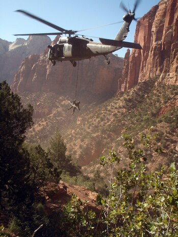 A team of seven Nellis Airmen aboard an HH-60G Pavehawk helicopter rescued a fallen climber at Zion National Park, Utah, May 9. The rescue crew consisted of four aircrew members from the 66th Rescue Squadron, and three pararescuemen from the 58th Rescue Squadron. After surveying the rescue area, the helicopter hovered over the injured climber and lowered the pararescuemen and a litter. The climber, who sustained neck and spinal injuries, was hoisted up into the helicopter within 20 minutes. The climber was admitted to Dixie Regional Medical Center, St. George, Utah. This mission by both rescue squadrons marks the second rescue mission that Nellis Airmen have responded to this year. (courtesy photo)