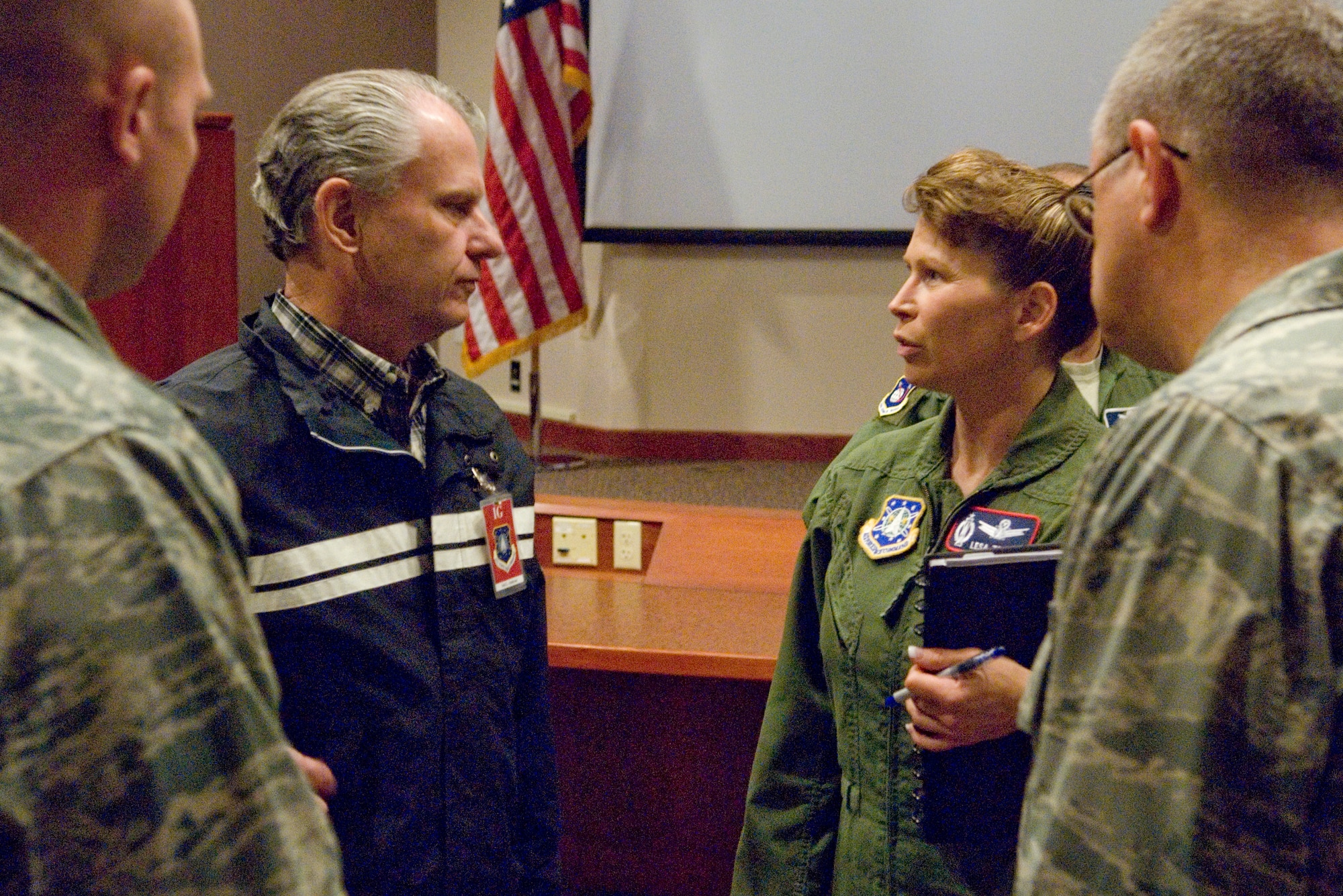 VANDENBERG AIR FORCE BASE, Calif.-- Jack Anderson, Air Force Space Command's Inspector General deputy chief, speaks with Lt. Col. Lesa Toler, the 576th Flight Test Squadron commander, at the Western Range Operations Control Center here May 12. The AFSPC IG is conducting a Unit Compliance Inspection of the 30th Space Wing from May 11-21. (U.S. Air Force photo/Senior Airman Christopher Hubenthal)