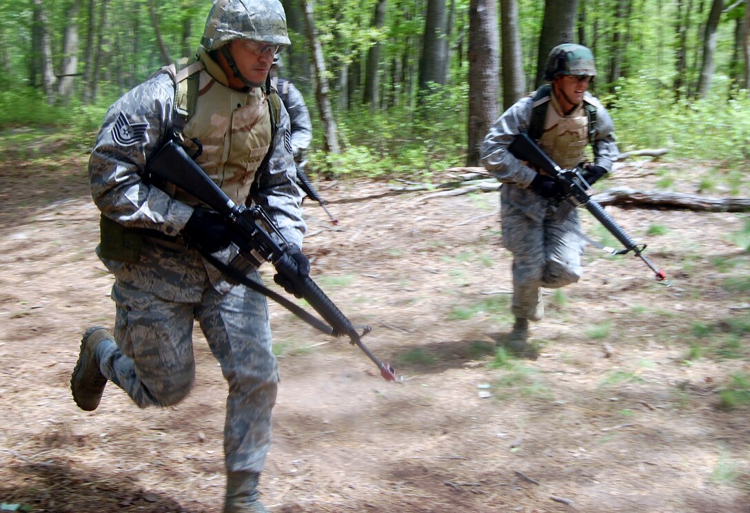 Students in the Advanced Contingency Skills Training Course respond to a scenario during training on a Fort Dix, N.J., range on May 11, 2009.  The training, taught by the U.S. Air Force Expeditionary Center's 421st Combat Training Squadron on Fort Dix, prepares Airmen for upcoming deployments.  (U.S. Air Force Photo/Tech. Sgt. Scott T. Sturkol)