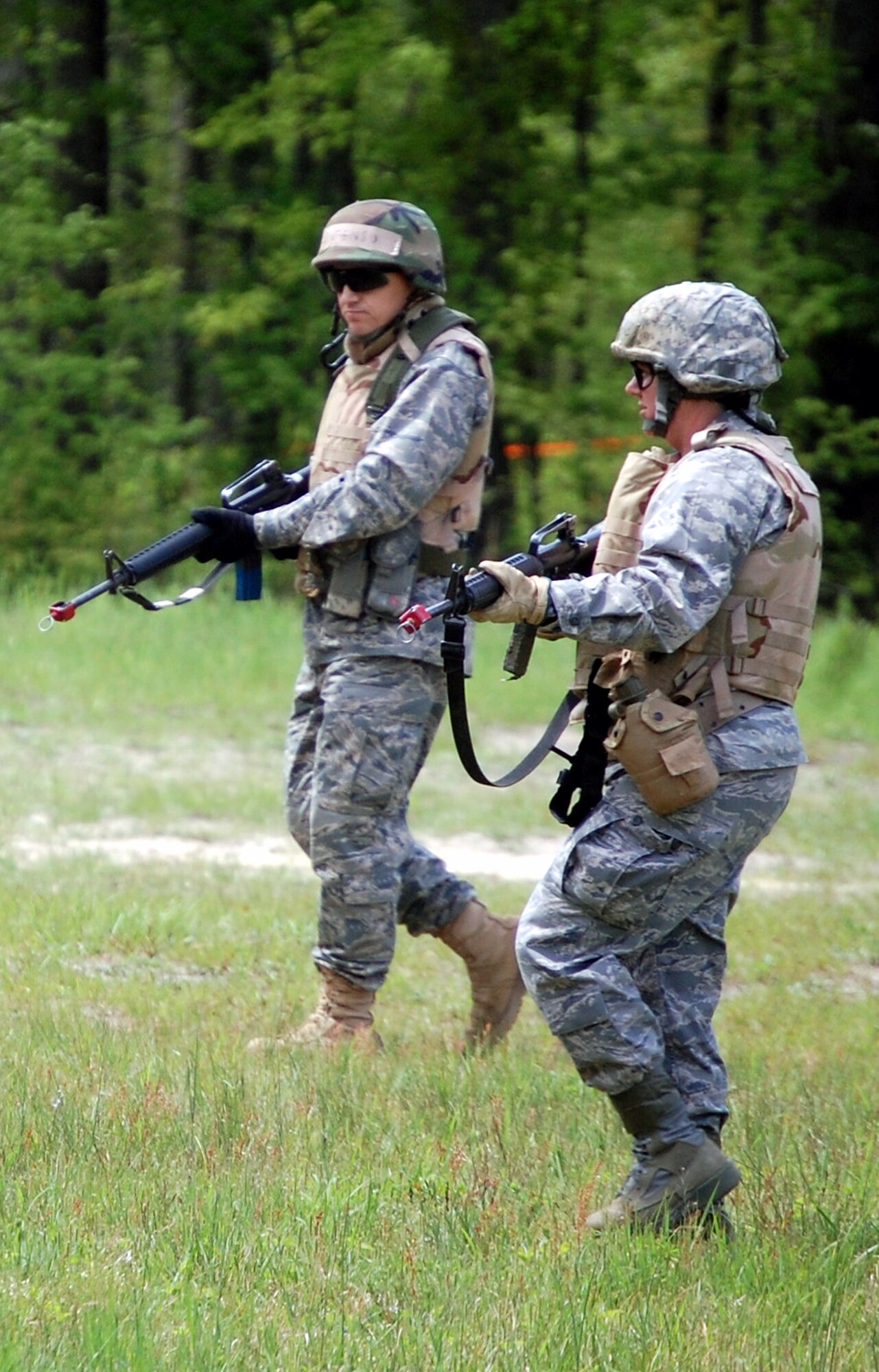 Students in the Advanced Contingency Skills Training Course walk in a patrol formation during training on a Fort Dix, N.J., range on May 11, 2009.  The training, taught by the U.S. Air Force Expeditionary Center's 421st Combat Training Squadron on Fort Dix, prepares Airmen for upcoming deployments.  (U.S. Air Force Photo/Tech. Sgt. Scott T. Sturkol)