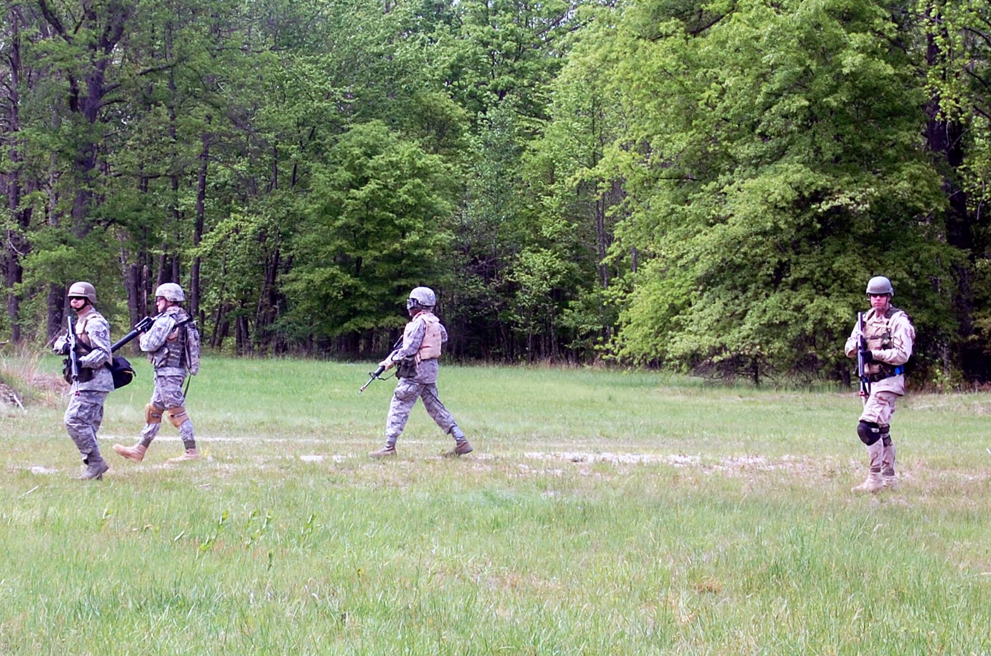 Students in the Advanced Contingency Skills Training Course walk in a patrol formation during training on a Fort Dix, N.J., range on May 11, 2009.  The training, taught by the U.S. Air Force Expeditionary Center's 421st Combat Training Squadron on Fort Dix, prepares Airmen for upcoming deployments.  (U.S. Air Force Photo/Tech. Sgt. Scott T. Sturkol)
