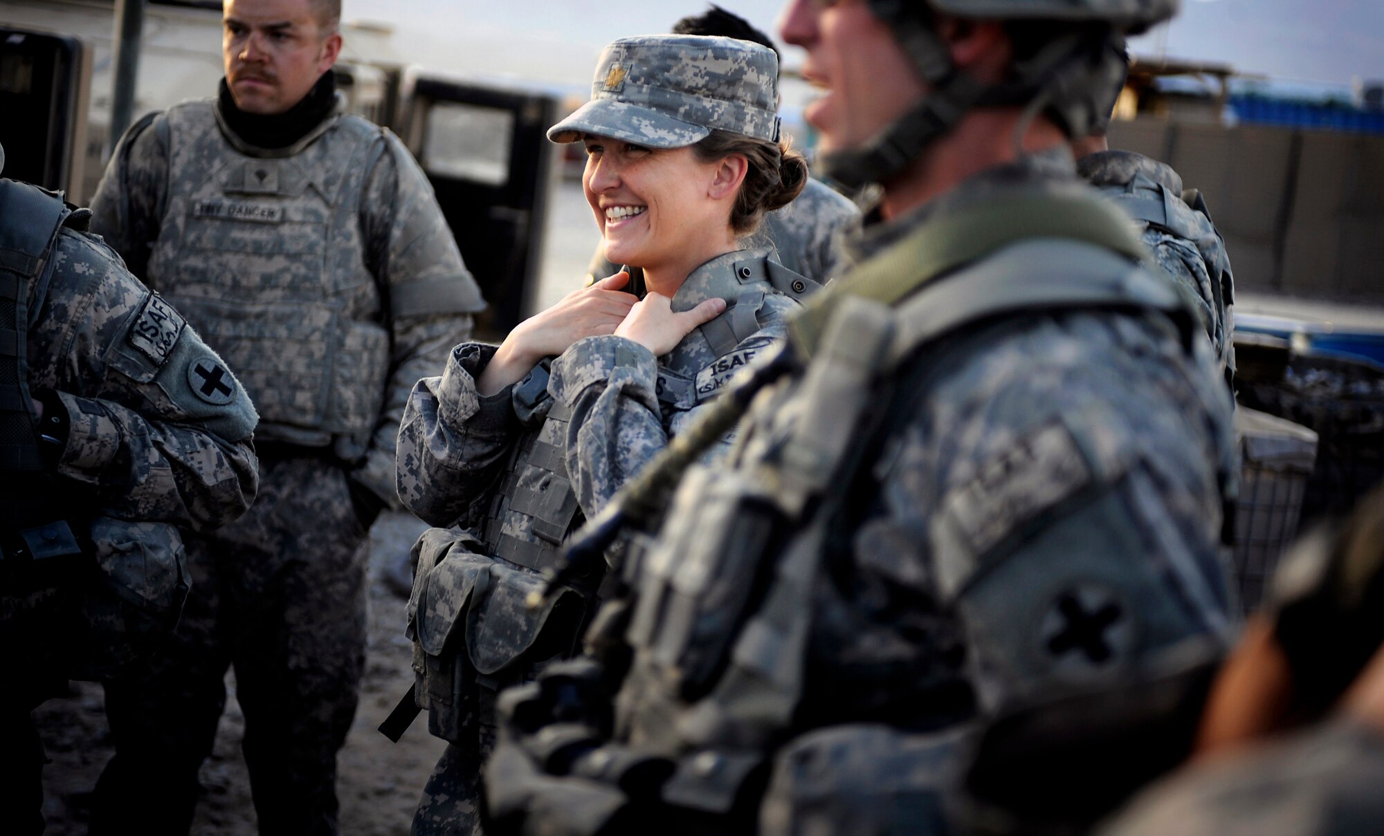 Maj. Kimberly Riggs shares a lighter moment with Soldiers of the Paktya Provincial Reconstruction Team Security Forces Platoon April 13 at Forward Operating Base Gardez, Afghanistan. Major Riggs is the engineer officer in charge of the Paktya Provincial Reconstruction Team. (U.S. Air Force photo/Staff Sgt. Shawn Weismiller)