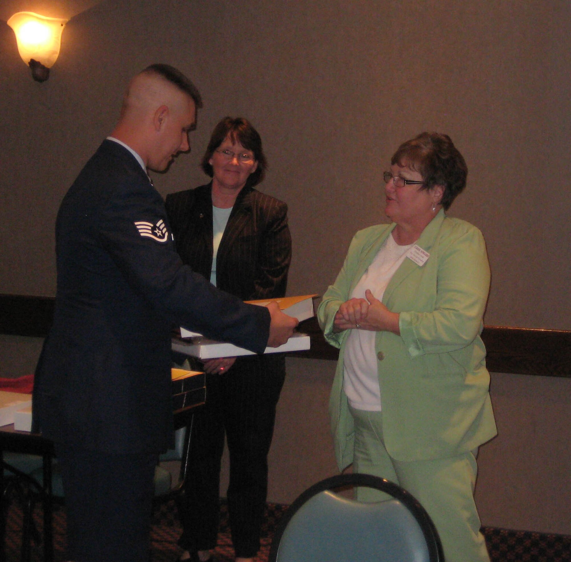 Staff Sgt. Joseph Hobert is awarded the annual Respect For Law Award for superior service by members of the Optimist Club of Wichita Falls May 12. (U.S. Air Force Photo/ Airman Adawn Kelsey)