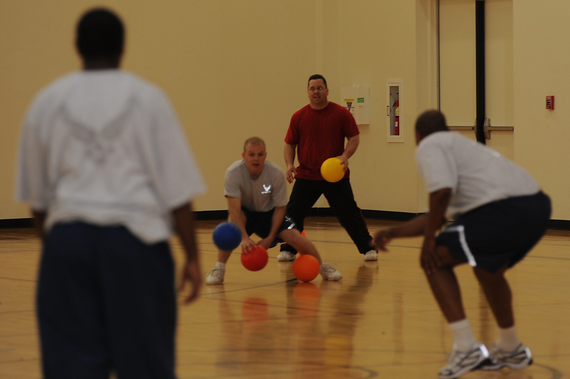 Airmen from the U.S. Air Force Expeditionary Center of Fort Dix, N.J., try to tag each other out with dodgeballs May 8 during the center's dodgeball tournament held at the McGuire Air Force Base, N.J., fitness center. The tournament was part of a fundraising effort for the Expeditionary Center's 15th anniversary committee.   (U.S. Air Force Photo/Staff Sgt. Nathan G. Bevier) 