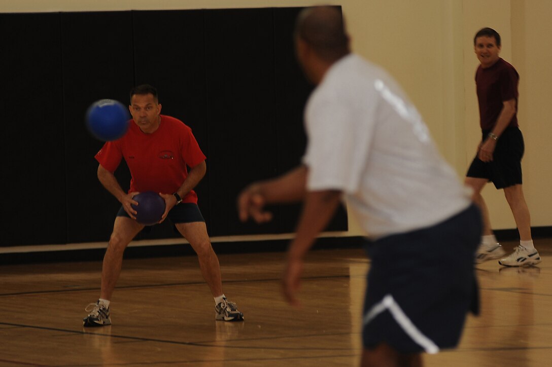 Lt. Col. Patrick "Rock" Verdon, from the U.S. Air Force Expeditionary Center's Mobility Operations School, keeps his eye on a dodgeball May 8 during the center's dodgeball tournament held at the McGuire Air Force Base, N.J., fitness center. The tournament was part of a fundraising effort for the Expeditionary Center's 15th anniversary committee.   (U.S. Air Force Photo/Staff Sgt. Nathan G. Bevier) 