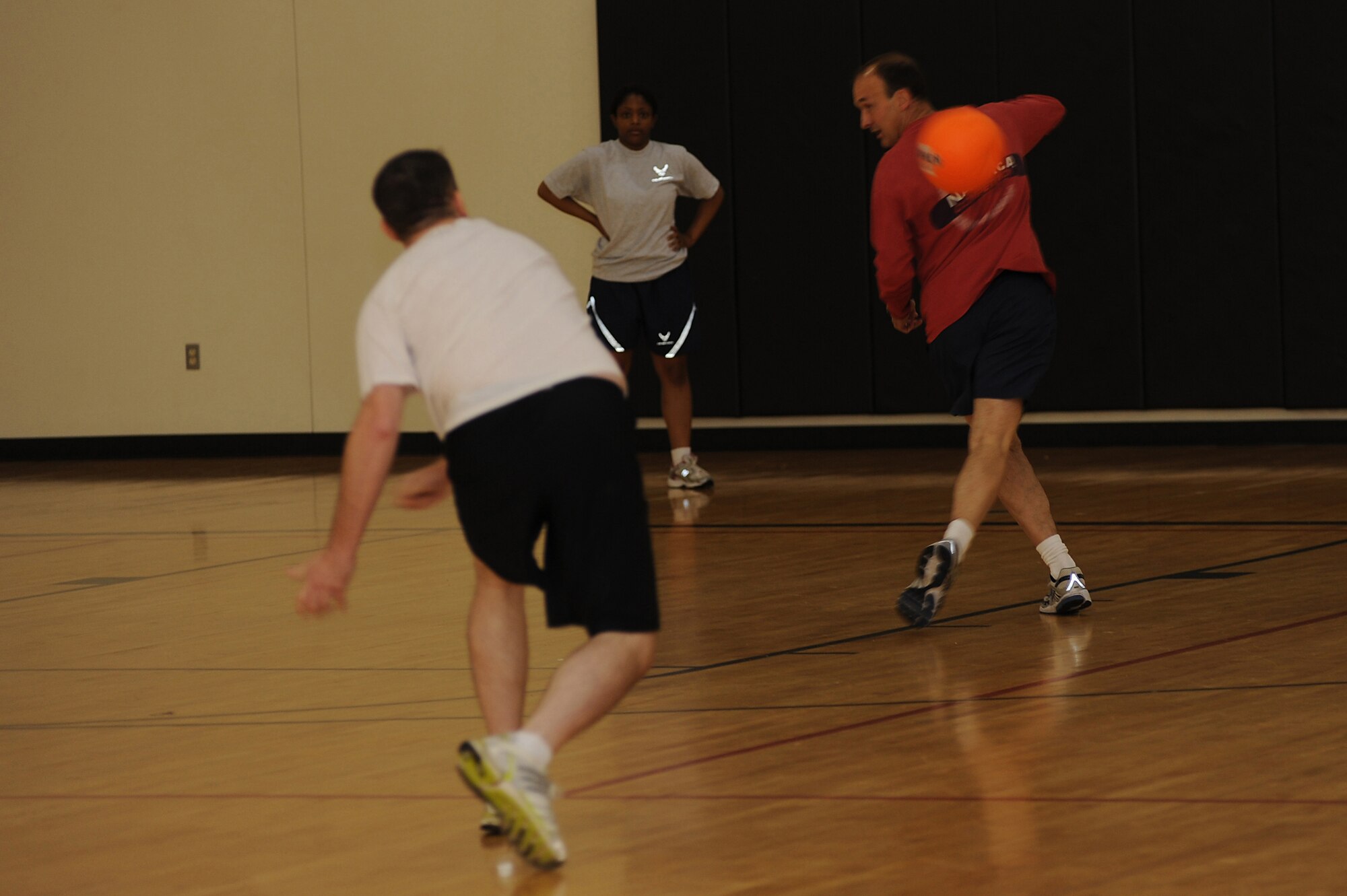 Lt. Col Richard Elkins, from the U.S. Air Force Expeditionary Center's Mobility Operations School, spins to miss from getting hit by a dodgeball May 8 during the center's dodgeball tournament held at the McGuire Air Force Base, N.J., fitness center. The tournament was part of a fundraising effort for the Expeditionary Center's 15th anniversary committee.   (U.S. Air Force Photo/Staff Sgt. Nathan G. Bevier) 