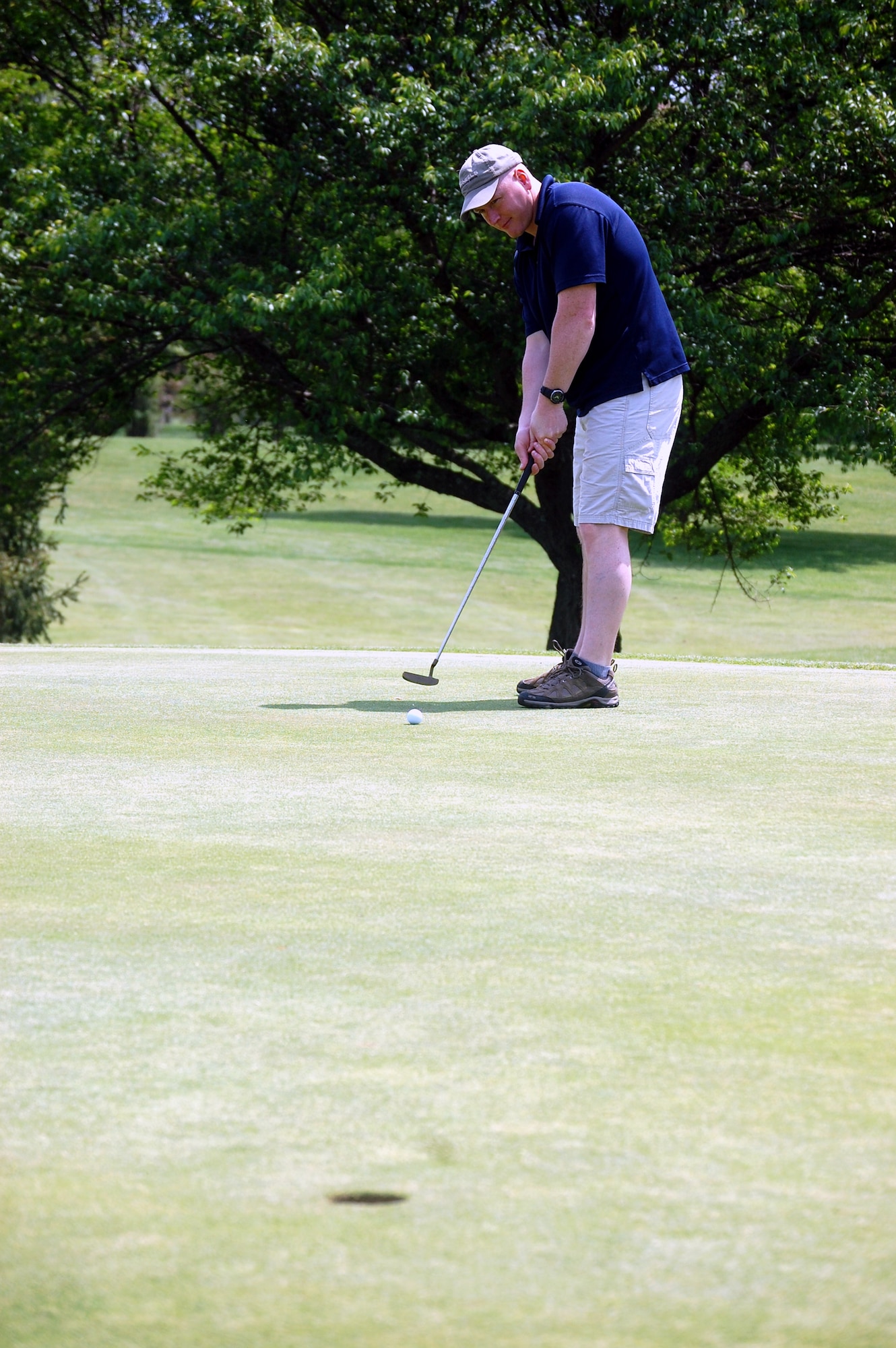 Senior Master Sgt. Scott Pepper, from the U.S. Air Force Expeditionary Center's 421st Combat Training Squadron, putts for par during the 2009 Nick Grand Memorial Golf Tournament on the Fort Dix, N.J., golf course on May 12.  The tournament is an annual fundraising tournament for the Expeditionary Center's Top Three organization.  (U.S. Air Force Photo/Tech. Sgt. Scott T. Sturkol)