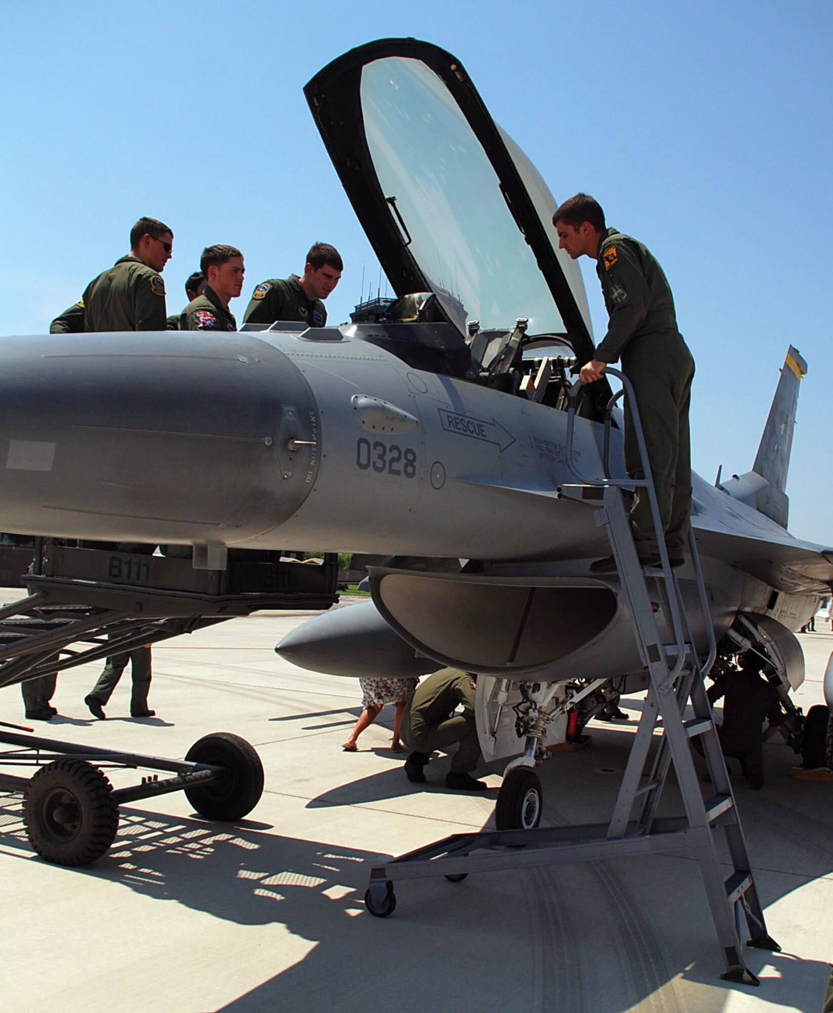 LAUGHLIN AIR FORCE BASE, Texas – First Assignment Instructor Pilots from the 47th Operations Group, look over an F-16 Fighting Falcon during FAIPAPALOOZA here May 8.  For the first time in history, Laughlin hosted the Air Education and Training Command event with FAIPs from across the command. It was a weekend–long event that included static displays of an F-16 and PC-12 and instruction from the pilots to help get them acquainted with major weapons systems they might fly in the future.  Also as a part of FAIPAPALOOZA Maj. Gen. Anthony Przybyslawski, Air Education and Training Command vice commander, spoke to a large group of the FAIP’s here to share wisdom and experience.  (U.S. Air Force photo by Airman 1st Class Sara Csurilla) 