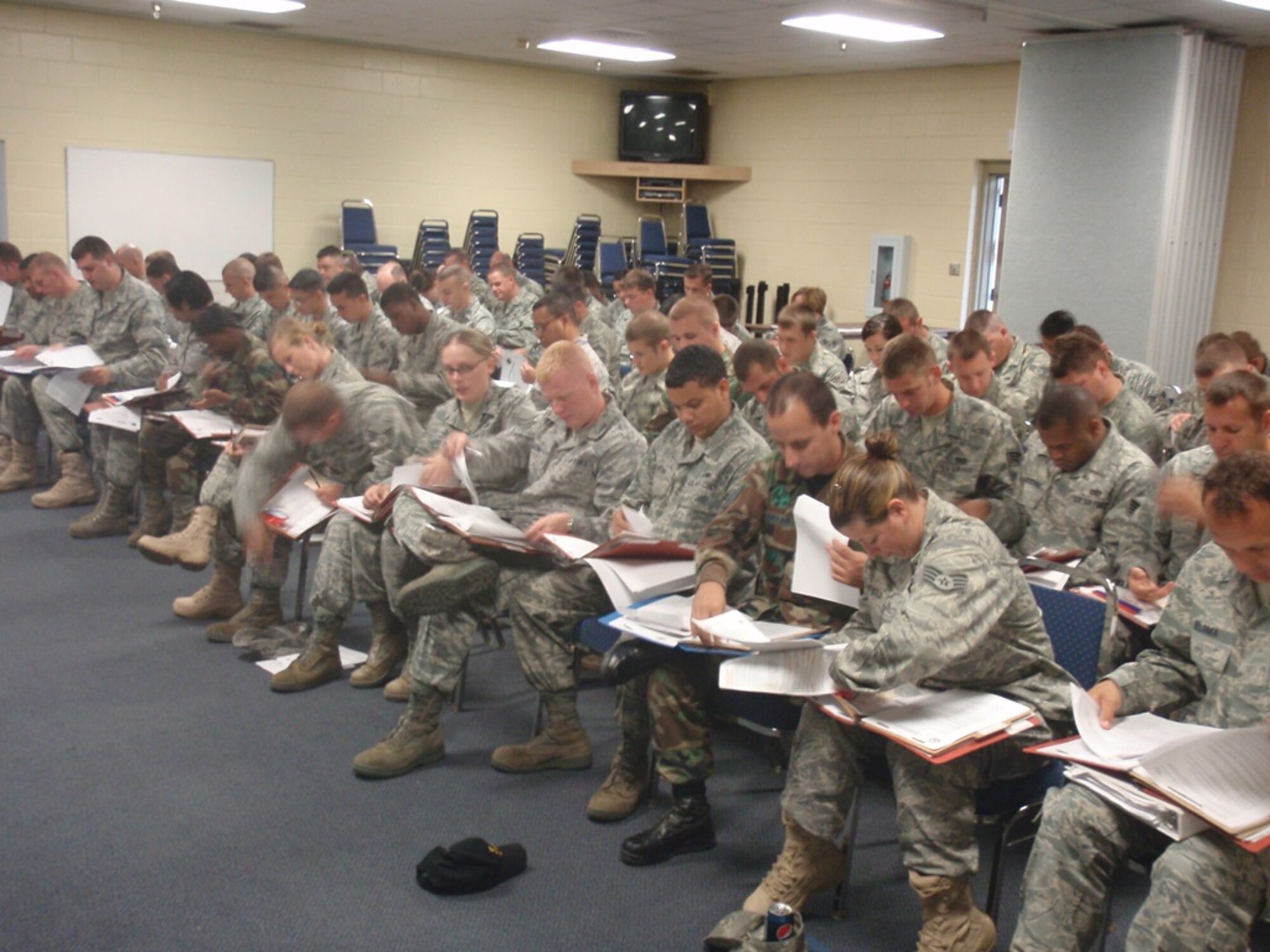 Airmen of the 728th Air Control Squadron sort through their mobility folders to make sure their paperwork is in line for the upcoming deployment. (U.S. Air Force photo/Senior Airman Rachel Chapman) 