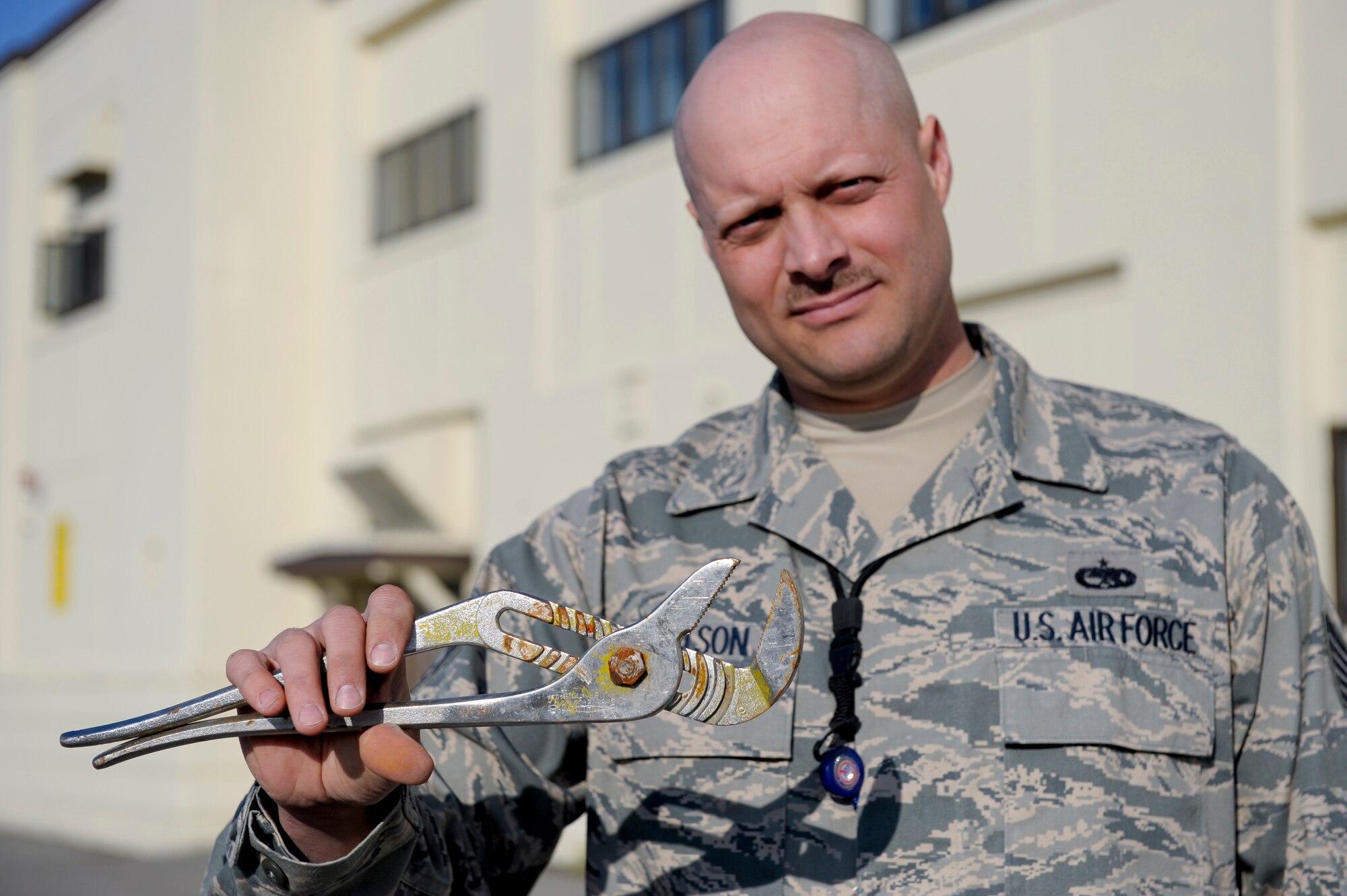 ELMENDORF AIR FORCE BASE, Alaska -- Tech. Sgt. Jason Knutson holds a wrench found on the FOD walk earlier in the day. FOD walks are an annual process which requires Airmen to walk and check the flighline for debris that may damage ground vehicles or aircraft.(U.S Air Force photo/Master Sgt. Keith Brown)