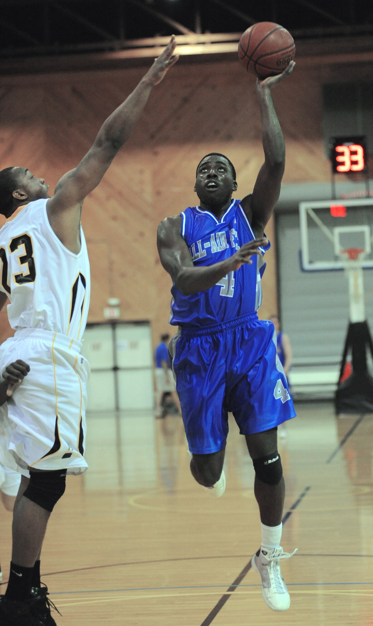 Second Lt.Danny Nwaelele, from Keesler Air Force Base, Miss., takes the ball to the hoop during a basketball game against the Army.  The Air Force men beat the Army team 62-59 in the first round of games for the Armed Forces Basketball Championship in Millington, Tenn. The tournament will run from May 12th through the 17th.  (U.S. Navy photo/Petty Officer 1st Class John Collins)
