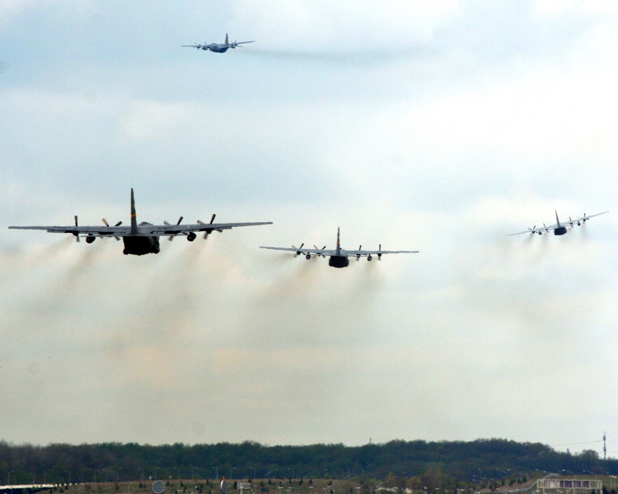PITTSBURGH IAP/ARS -- Four Air Force Reserve Command C-130's from the 758th Airlift Squadron take off on their way to conduct a training exercise, May 2, 2009 (Photo by Tech Sgt. Ian Carrier).

